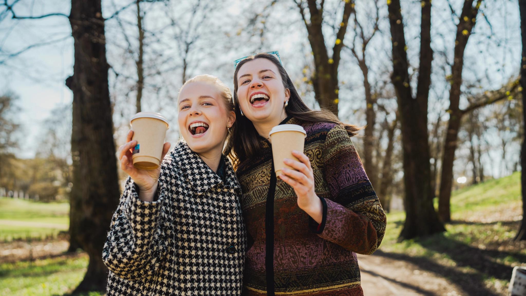 Two girls drinking coffee