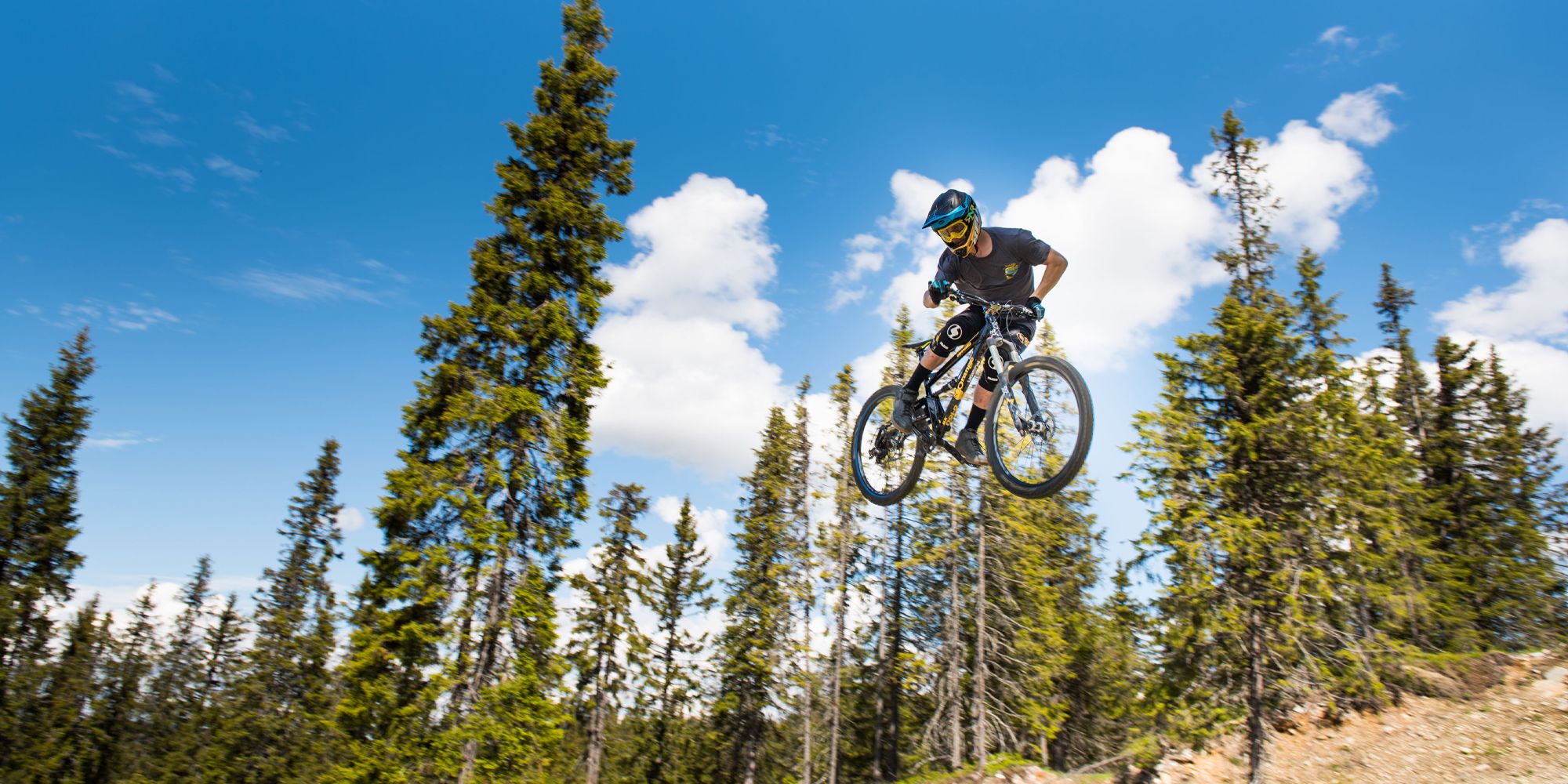 A person jumping with his mountain bike in Hafjell bike park, Eastern Norway