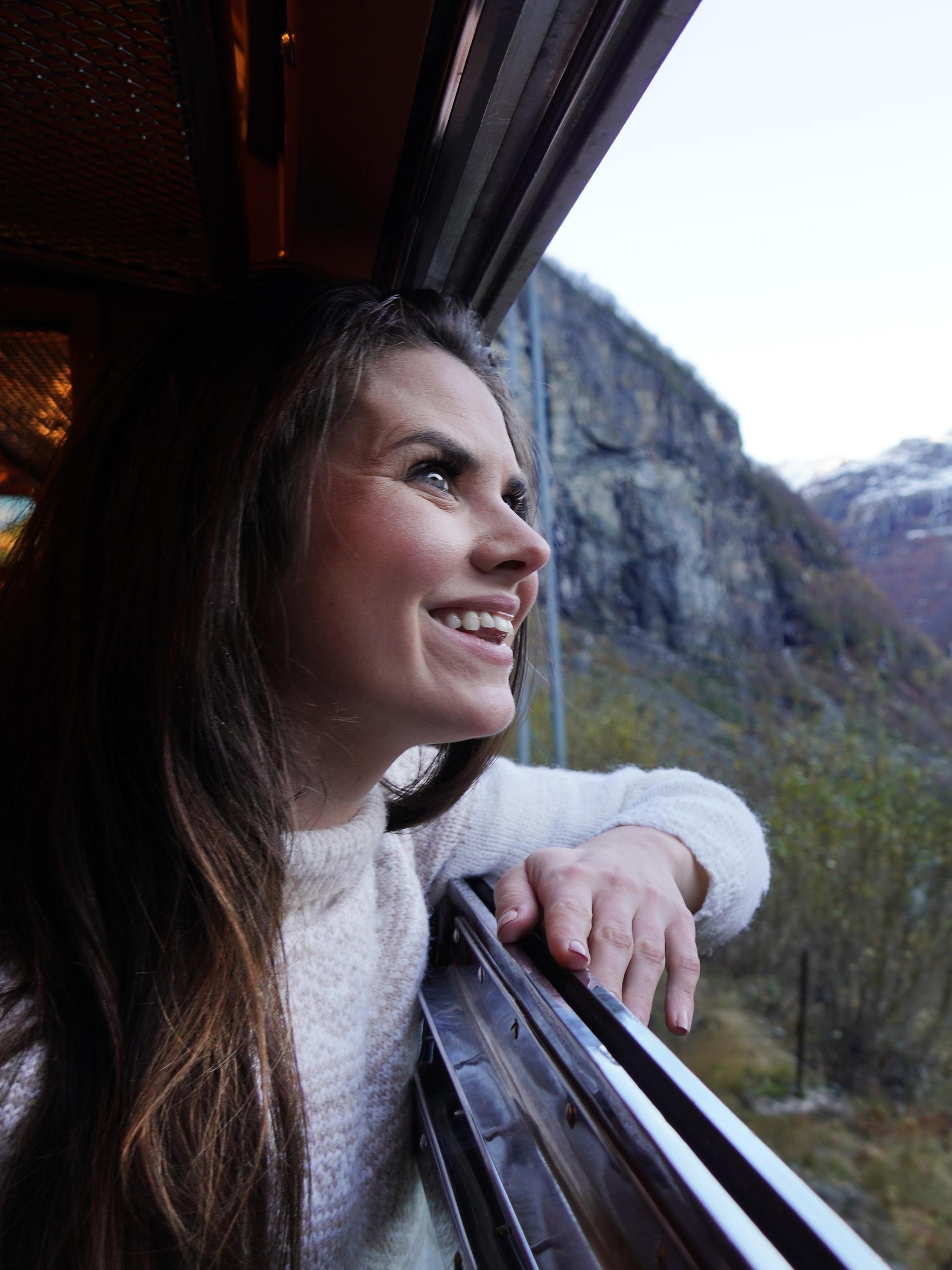 Woman looking out of a train window