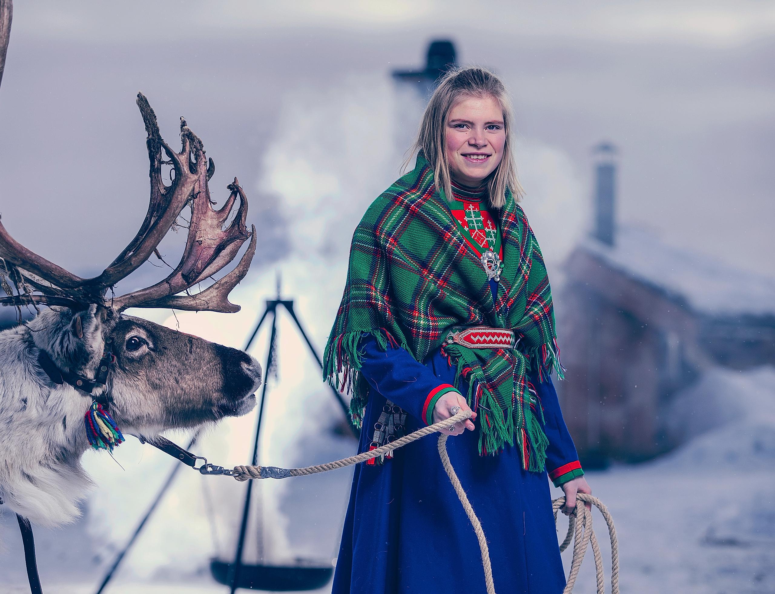 Young Sami woman with a reindeer in Røros