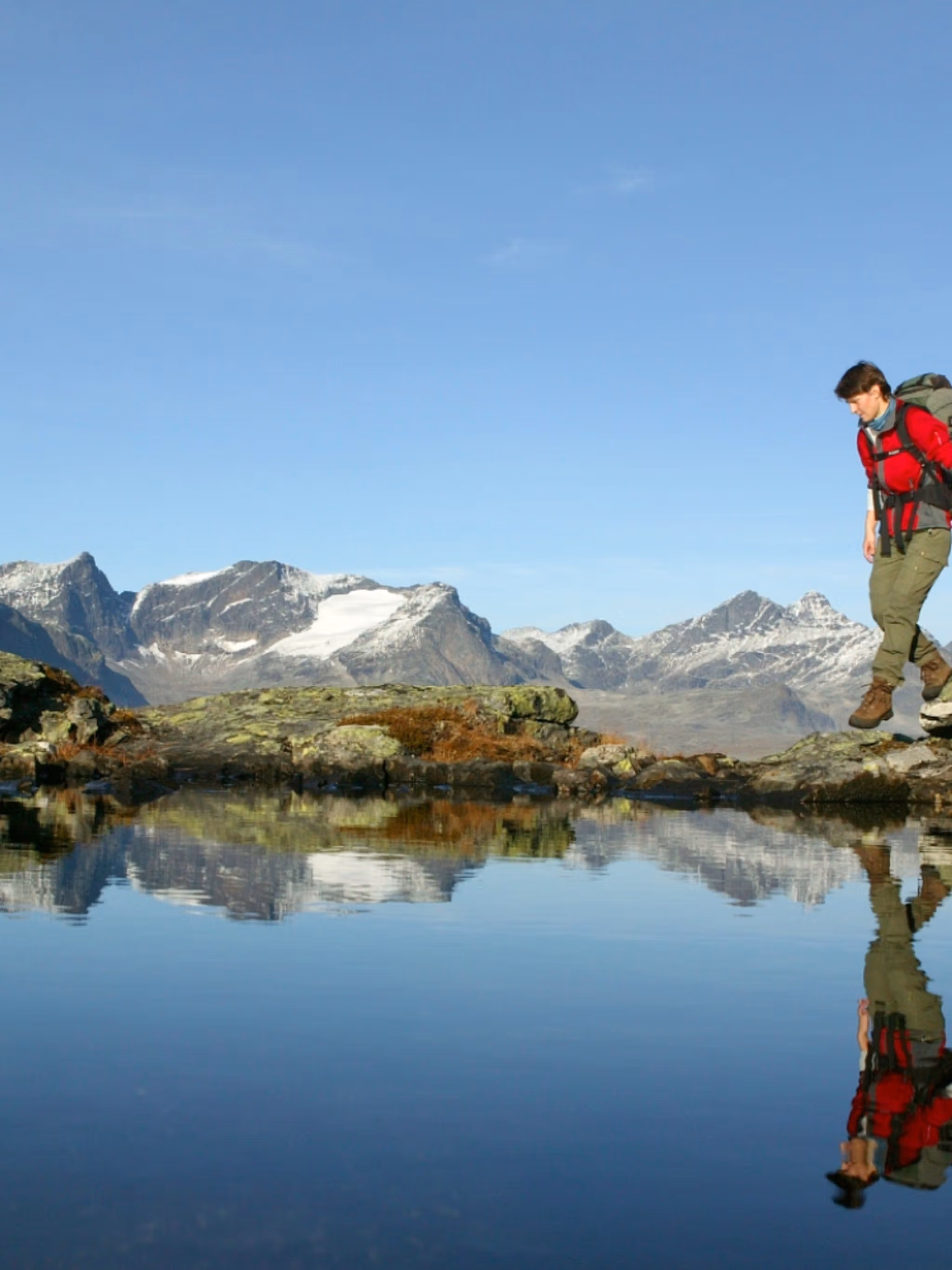 Woman walking the Besseggen ridge in Valdres