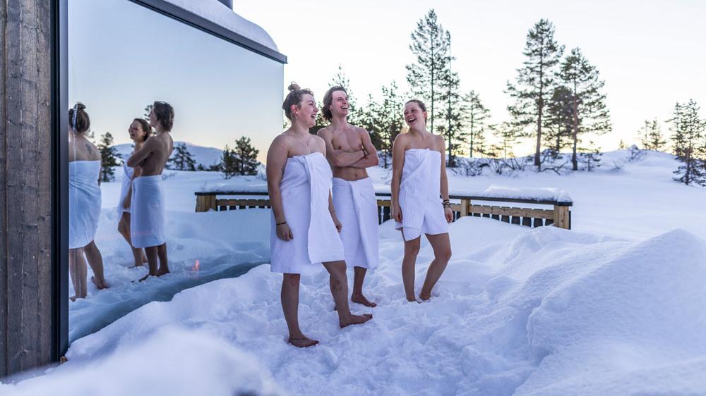 Three people doing winter bath and sauna in Vrådal