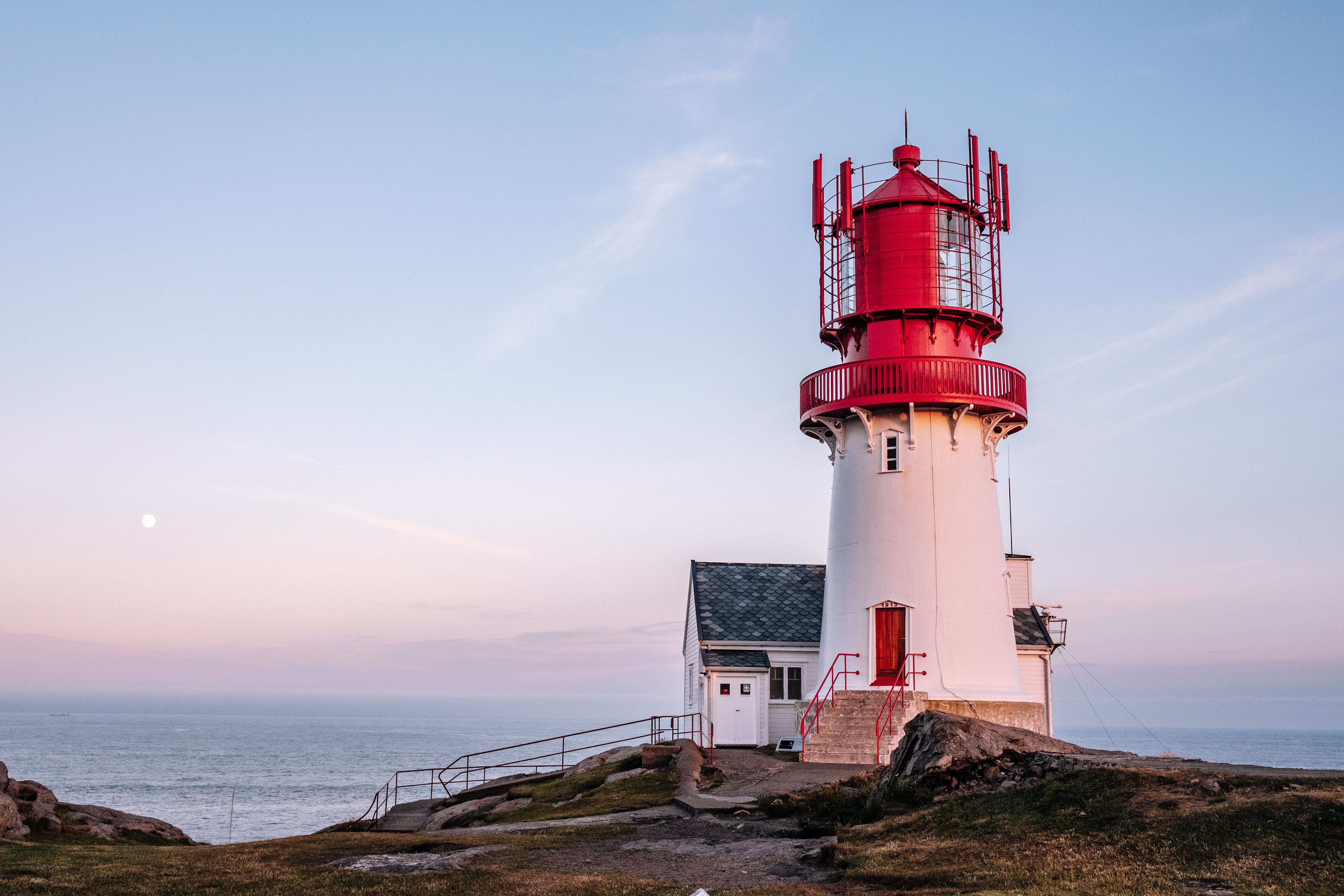 Lindesnes lighthouse in Southern Norway during sunset.