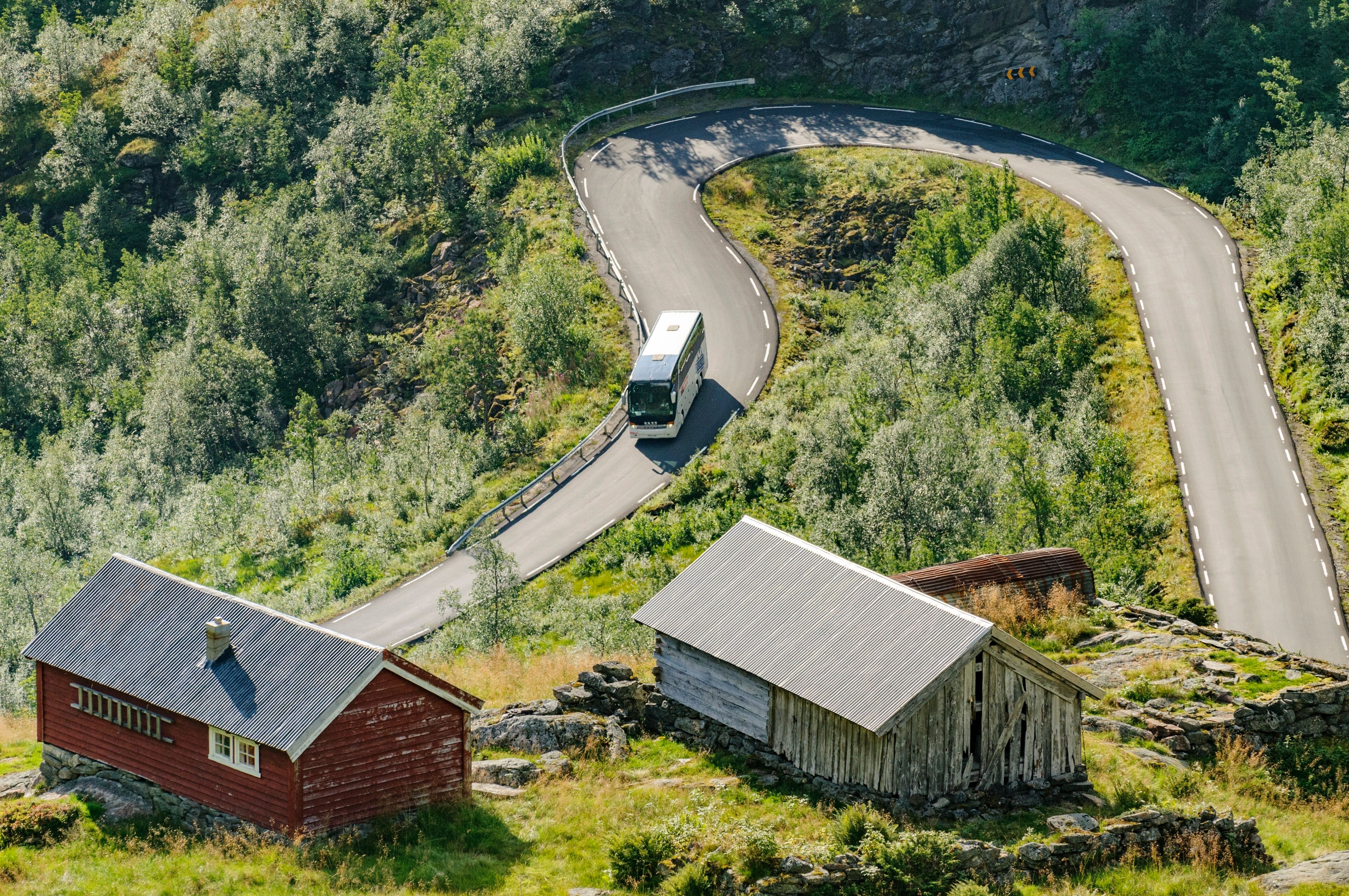 Bus driving down hairpin road in Gaular