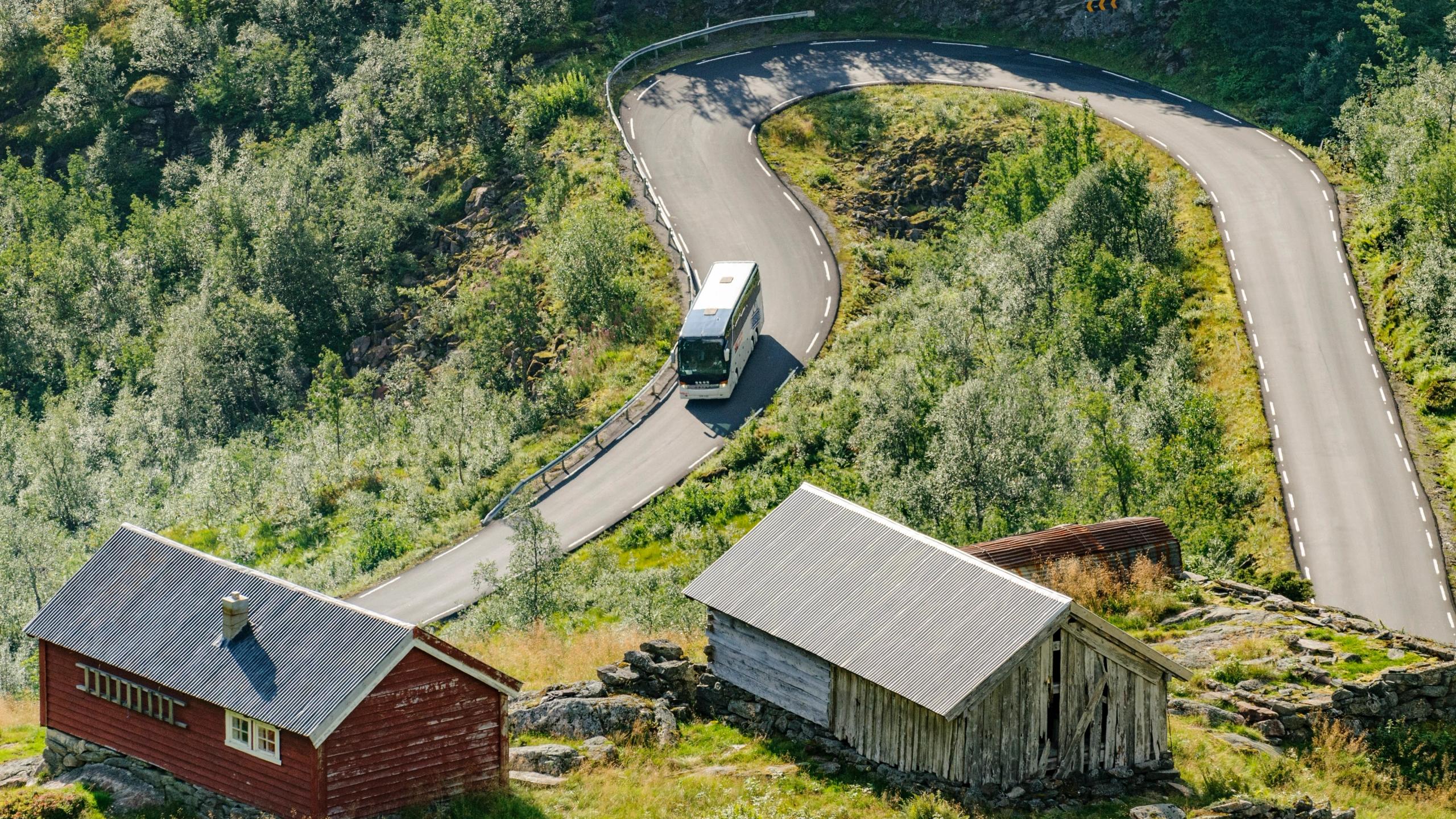 Bus driving down hairpin road in Gaular