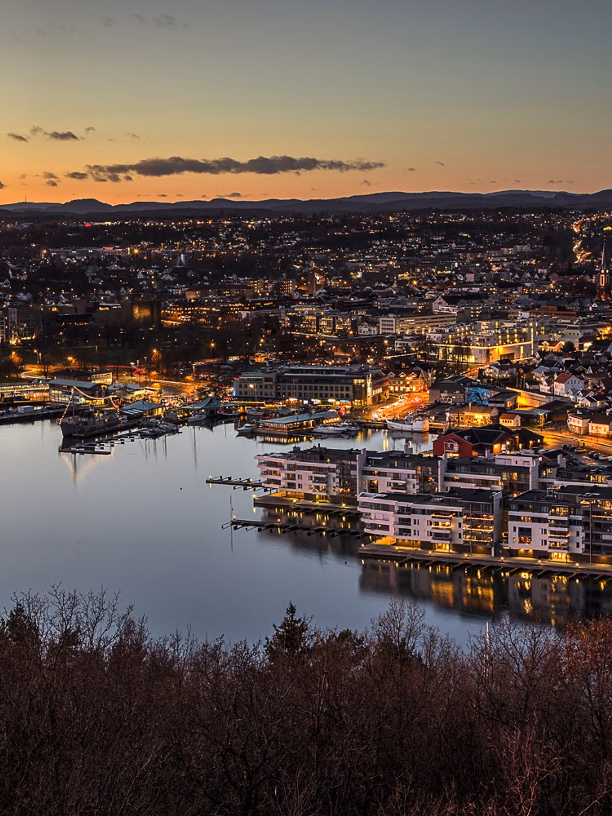 Sandefjord, and the surrounding fjord, seen from a distance at night time