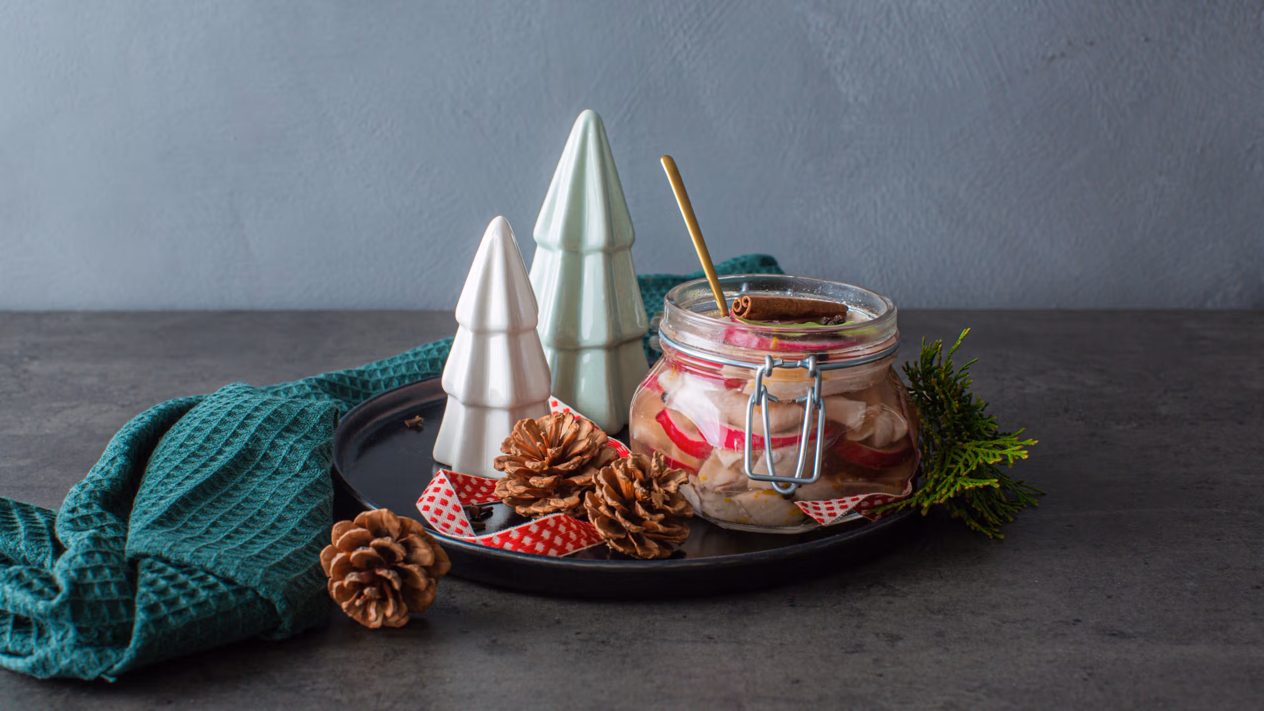 Traditional Norwegian pickled herring in a glass jar