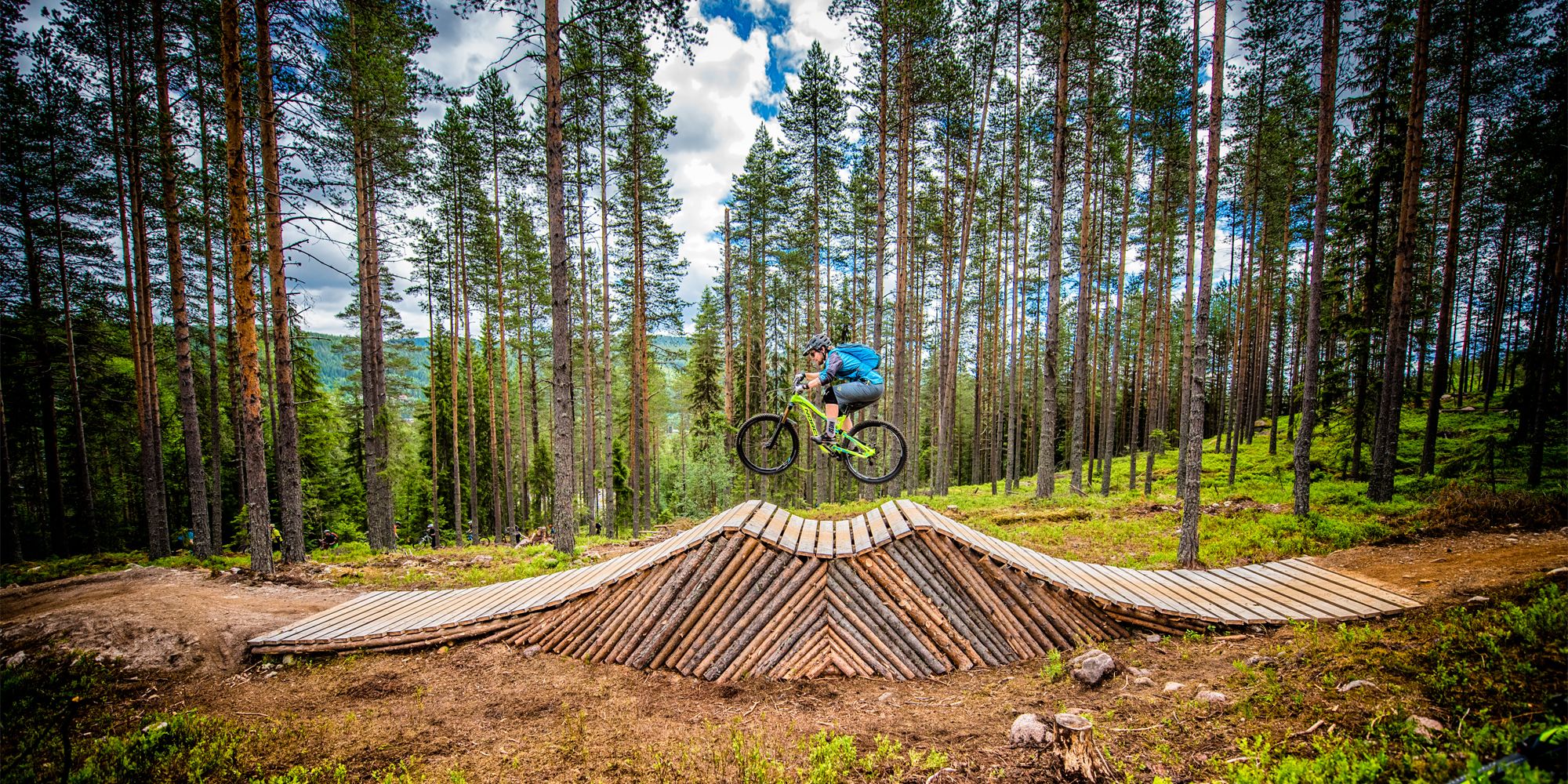 A person cycling on an obstacle in Trysil bike arena in Eastern Norway