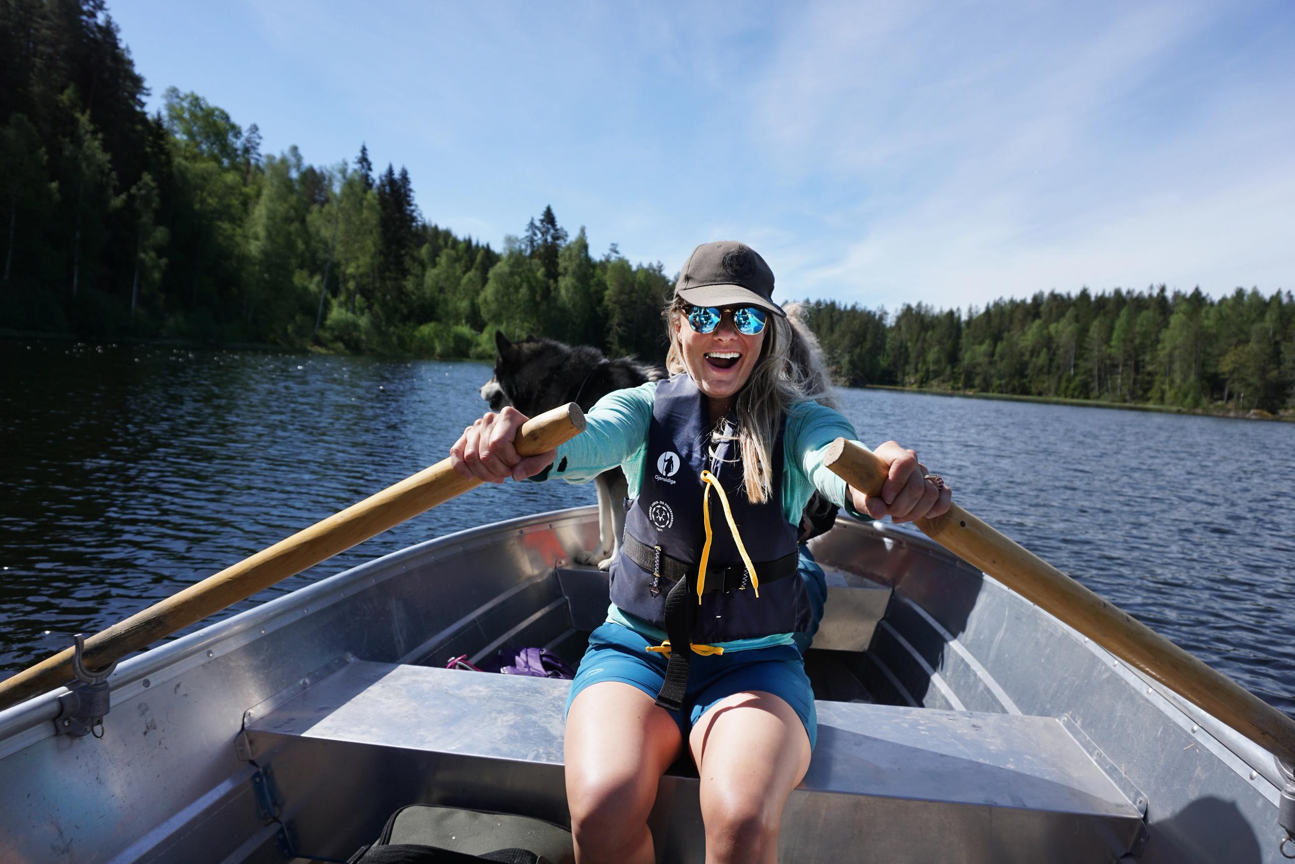 A woman rowing a boat in Norway