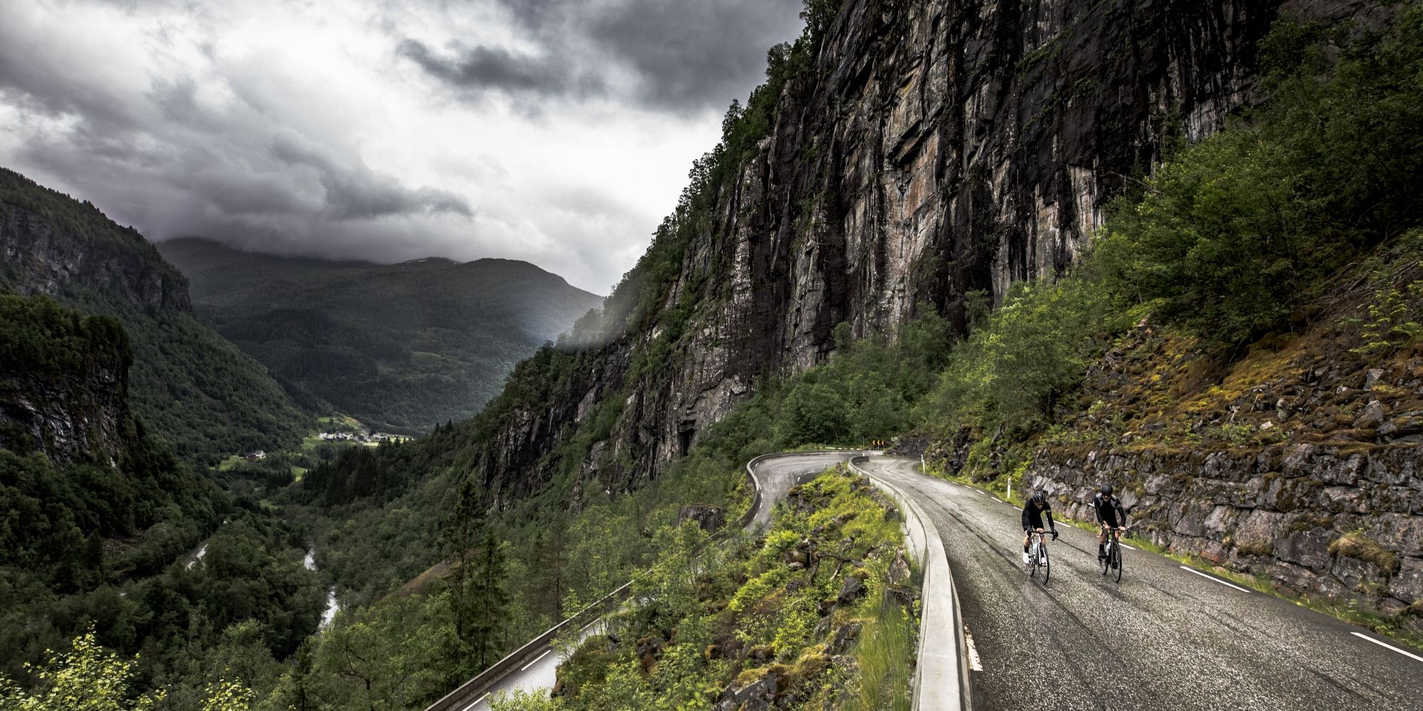 A group of road cyclists in a hairpin bend in Fjord Norway