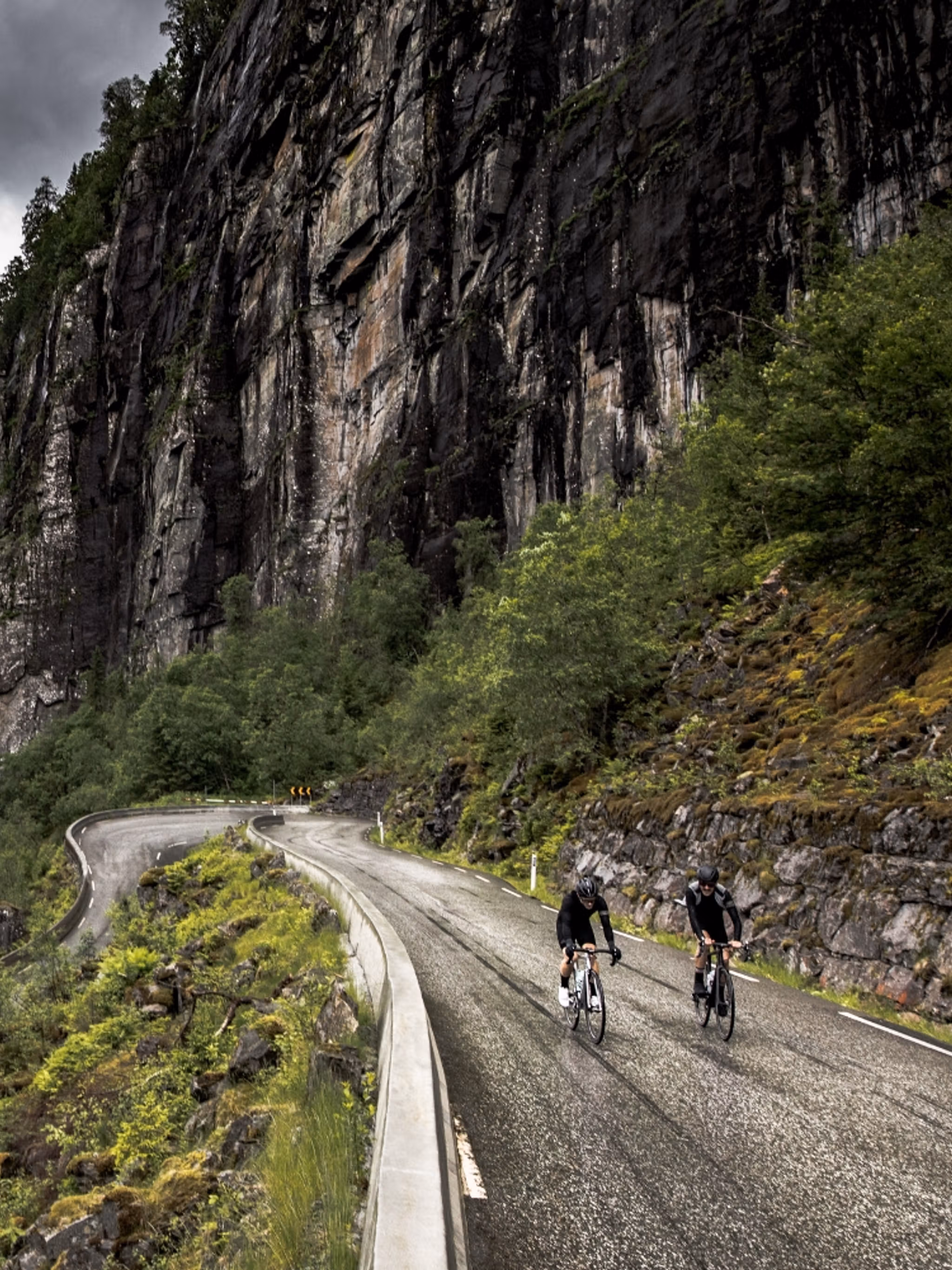 A group of road cyclists in a hairpin bend in Fjord Norway