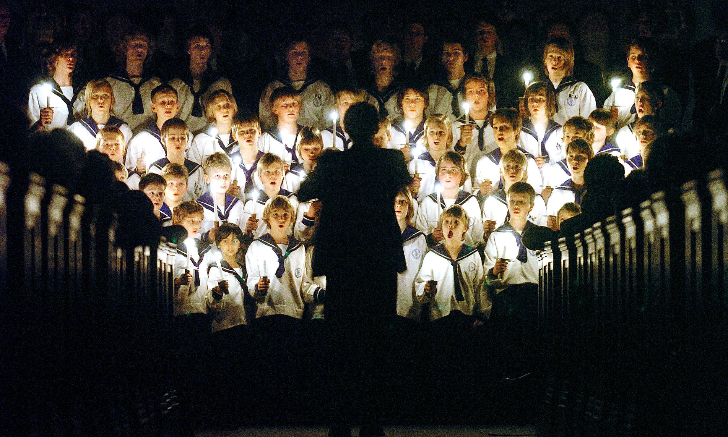 The boy choir is singing Christmas songs in a church in Oslo, Norway