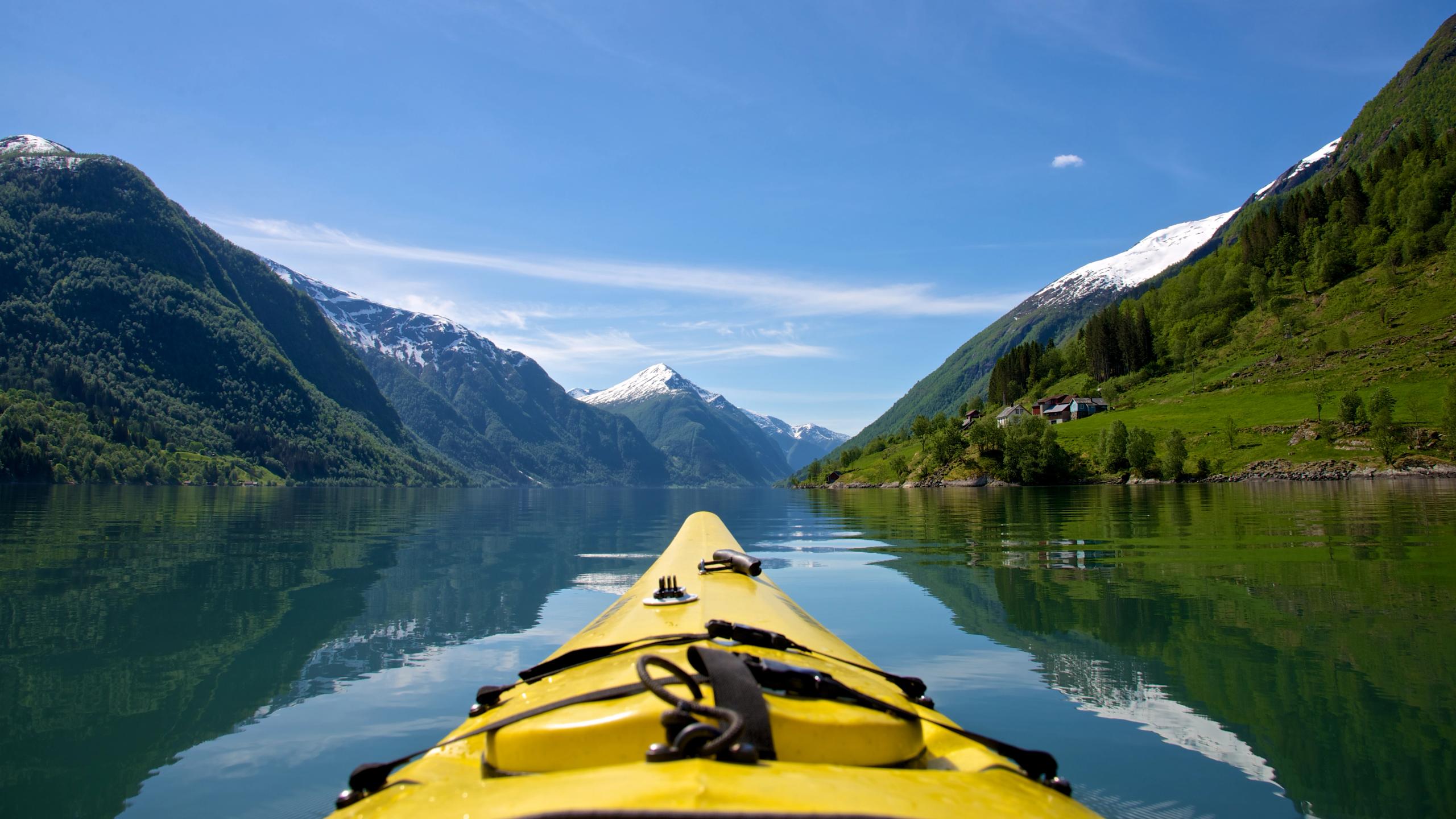 The tip of a kayak on Fjærlandsfjorden in Fjord Norway in a sunny day