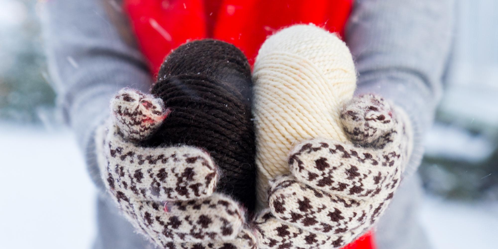 A woman holding yarn used to make Selbu mittens, Trøndelag, Norway.