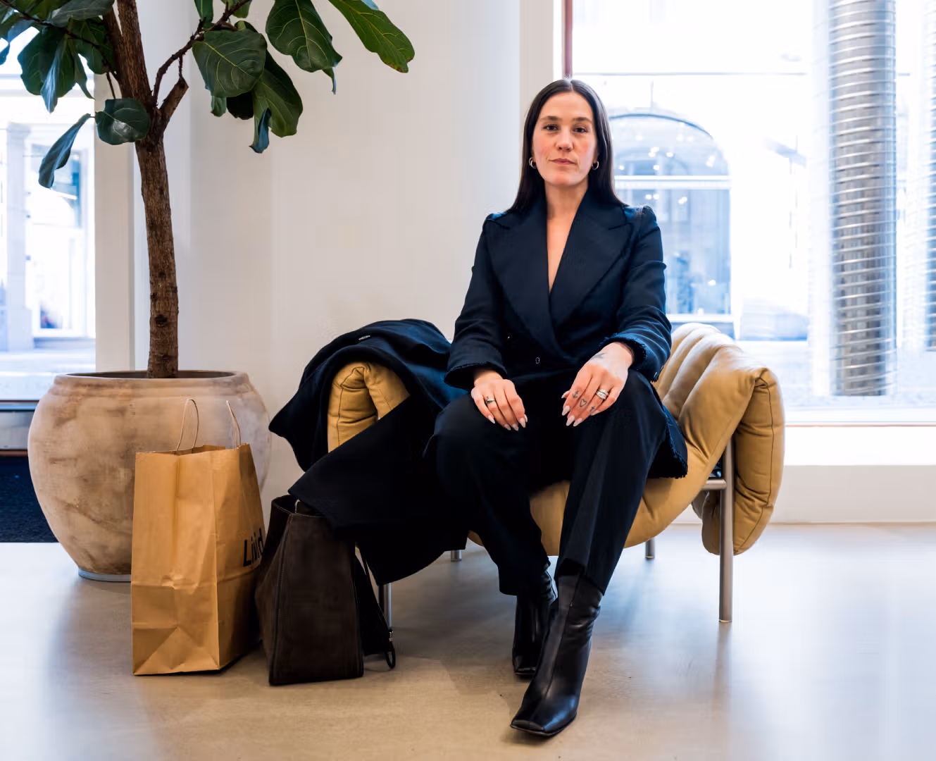 Ida Elise Eide Einarsdottir sitting in a chair at Tom Wood