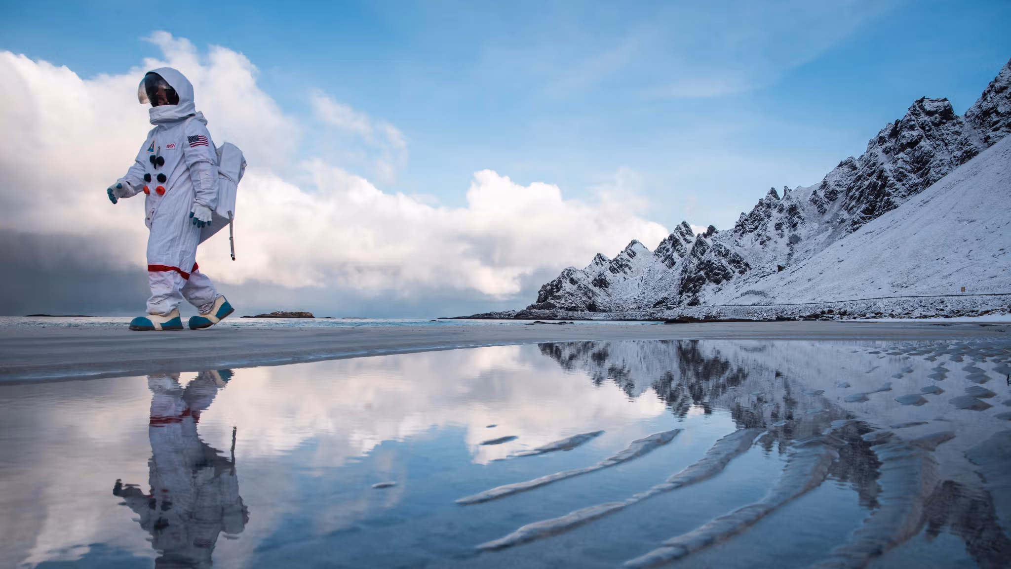 An "astronaut" from Andøya Space walking along Bleikstranda beach at Andøya