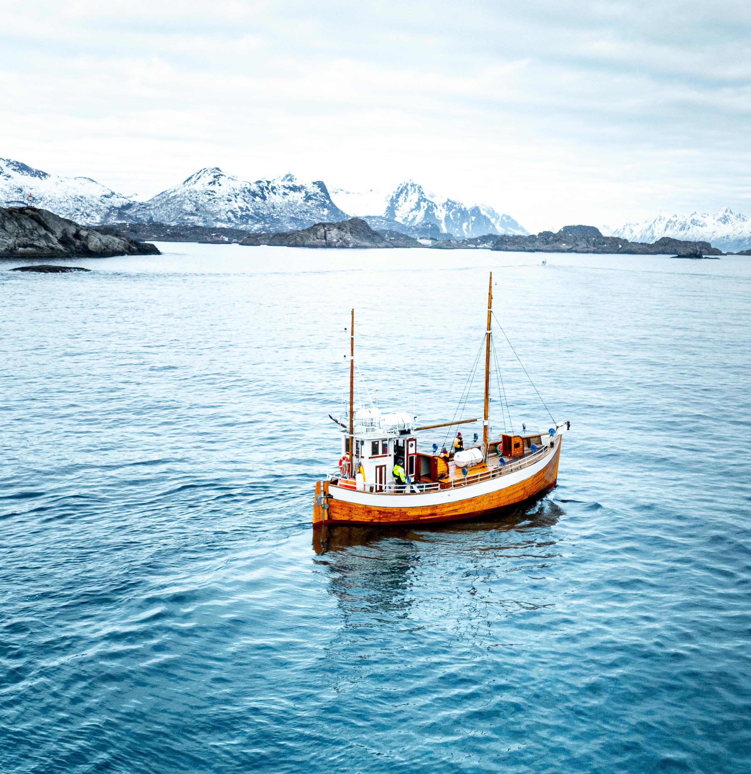 An old fishingboat out at sea in Lofoten