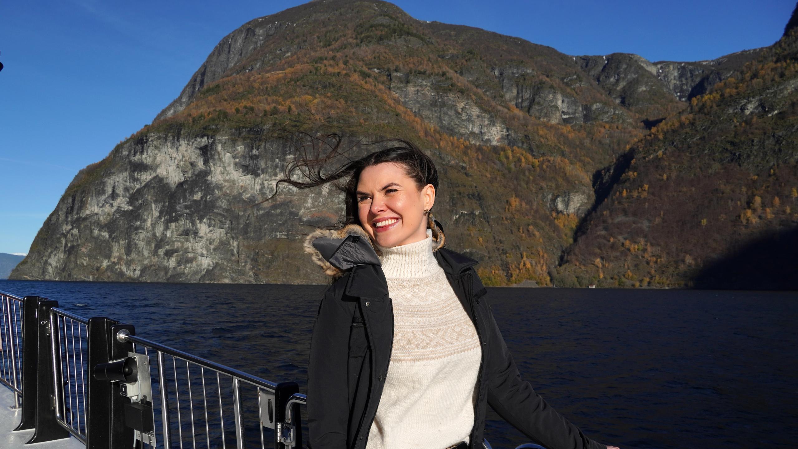 Woman on a cruise in a fjord.
