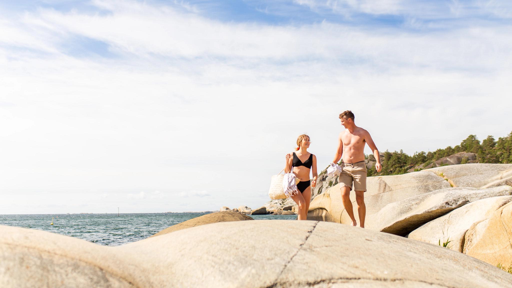 Couple enjoying summer at Ula beach in Larvik