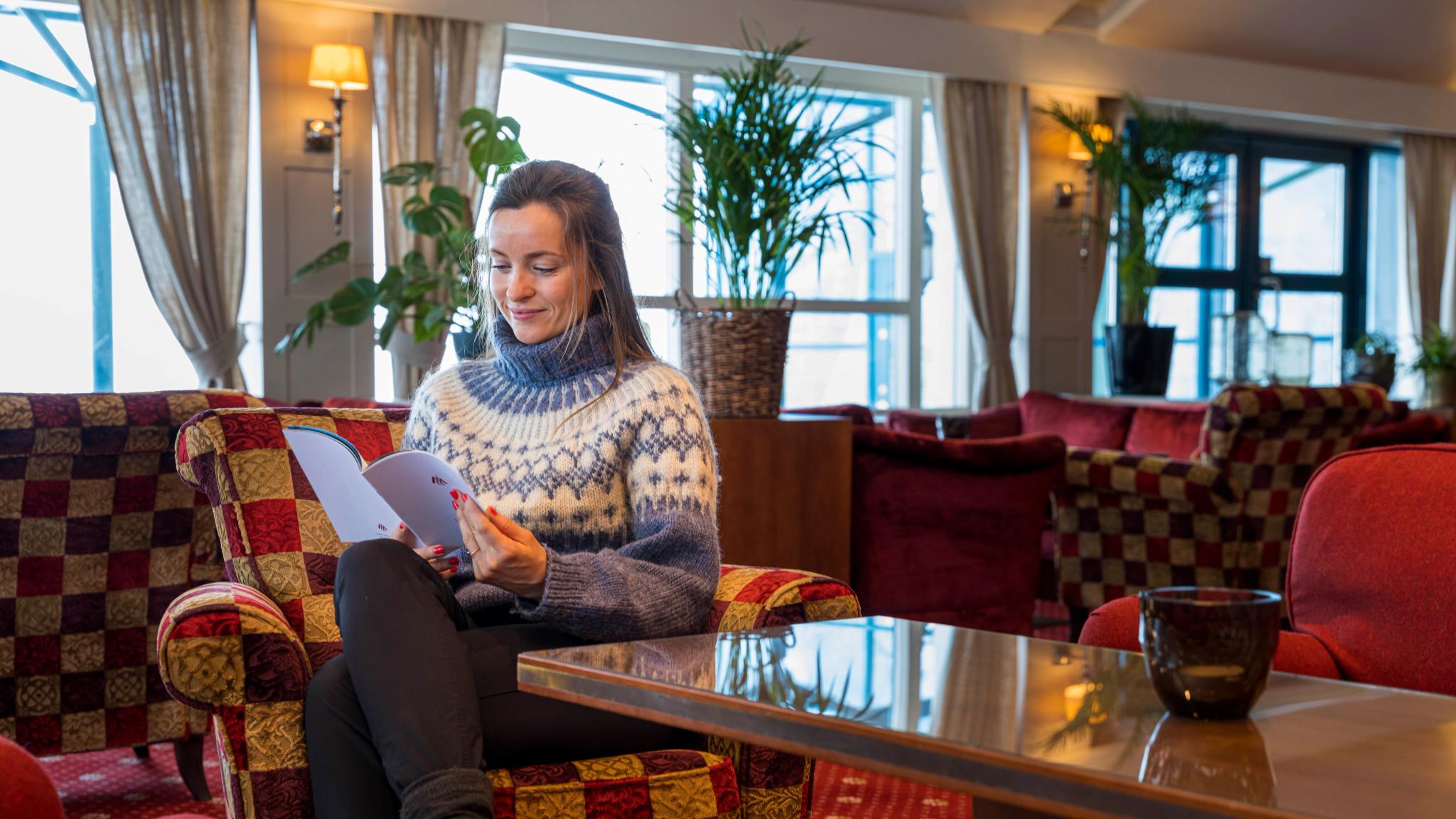 Woman reading in the lobby at Hotel Union