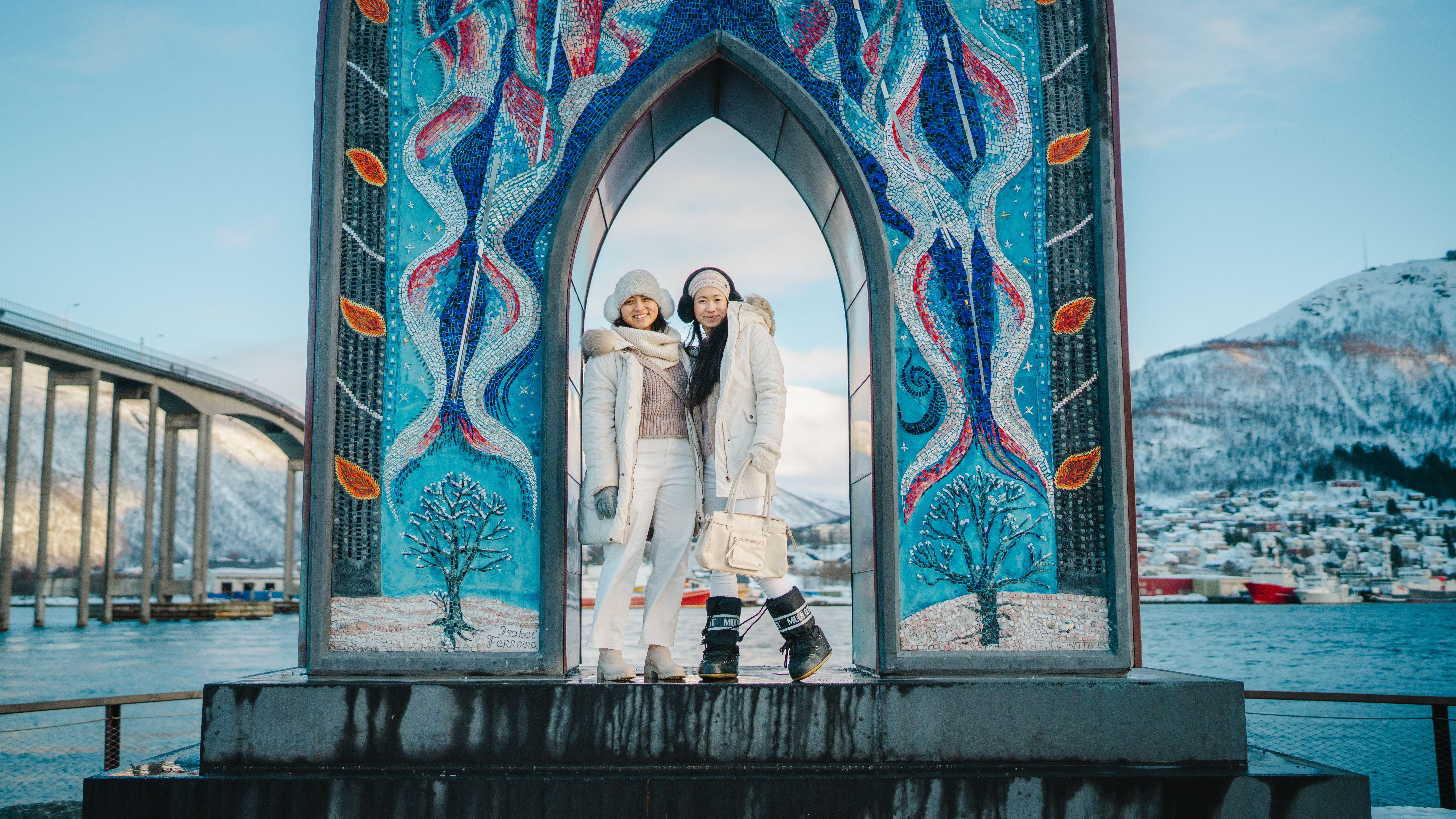 Two people standing in the "gateway to the Arctic".
