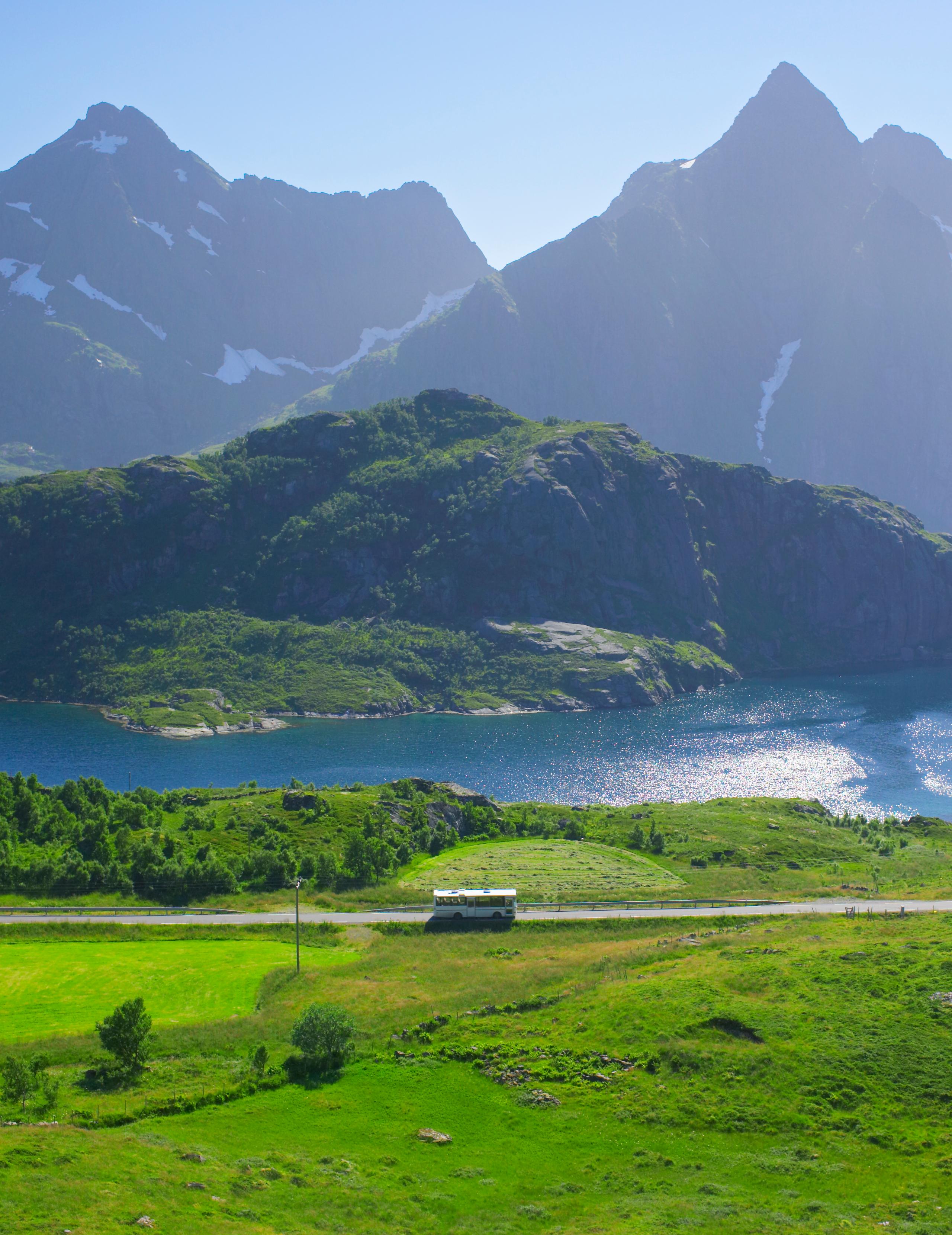 A bus in the summer landscape in Lofoten, Northern Norway.