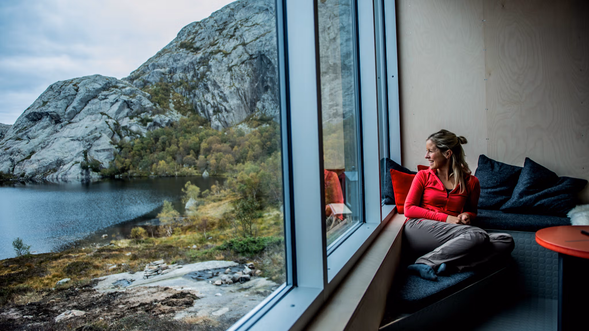 A woman enjoying the view from a cabin.