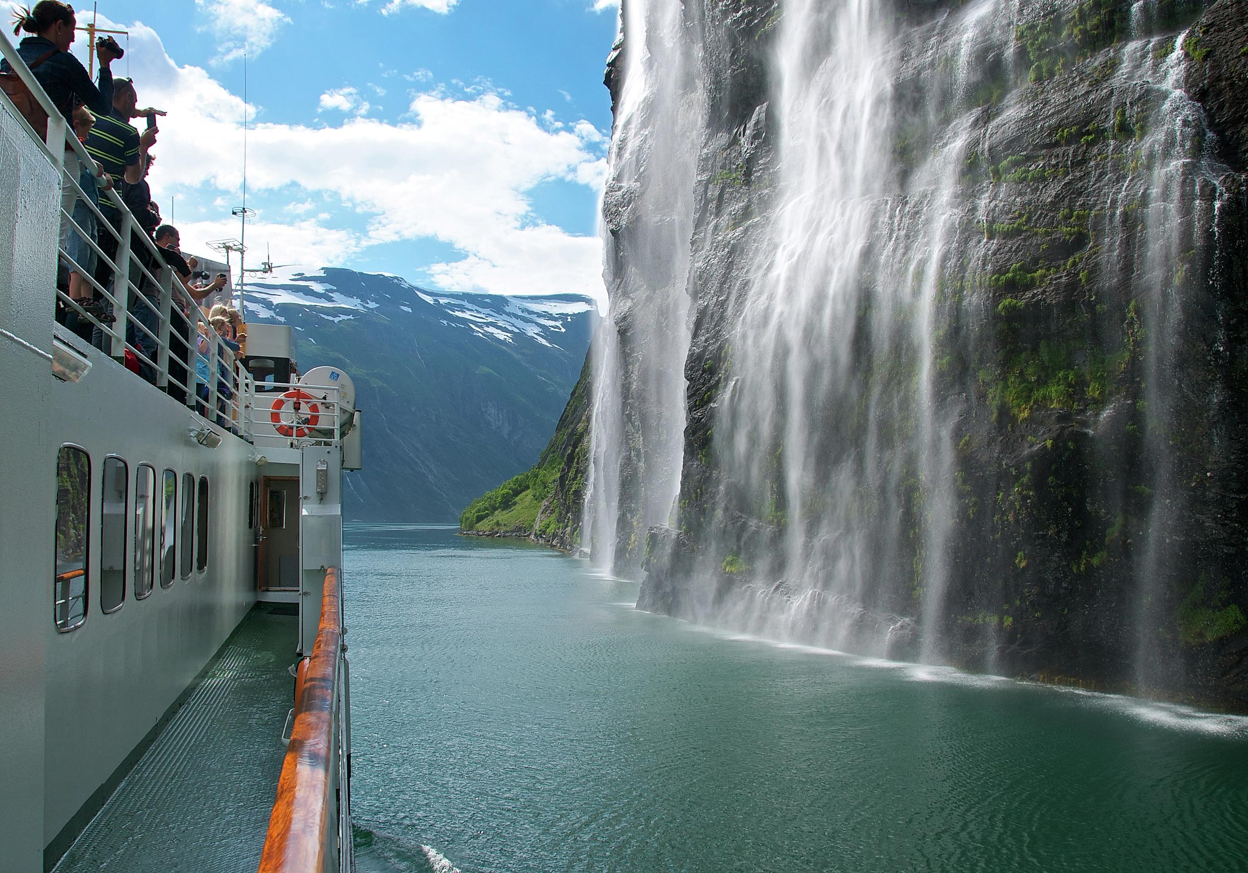 Cruising by Brudesløret Waterfall in Geiranger, Fjord Norway