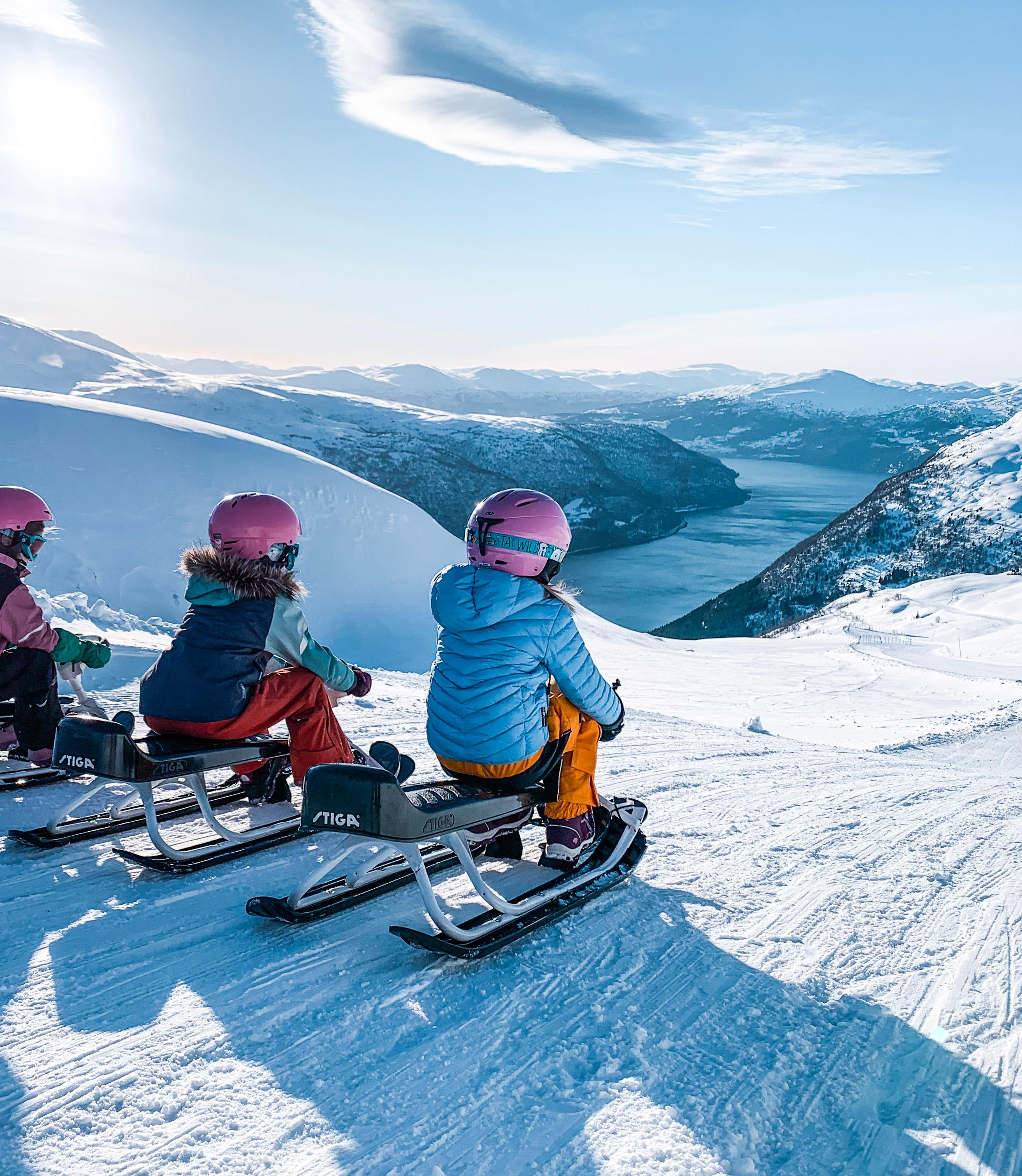 Girls on sleds at Loen Skylift, Norway.