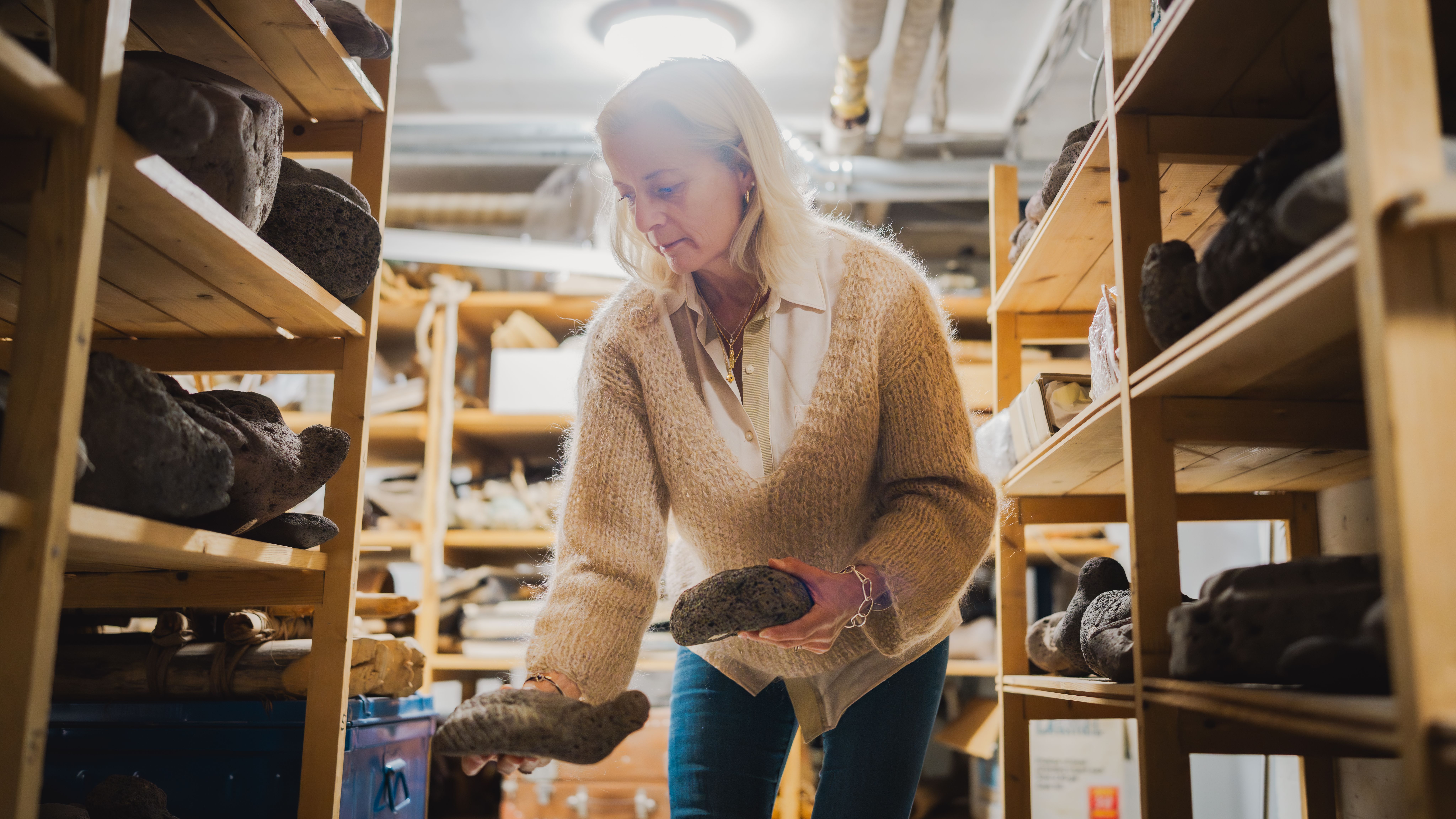 Liv Heyedahl in the archives looking at objects from the Easter Island