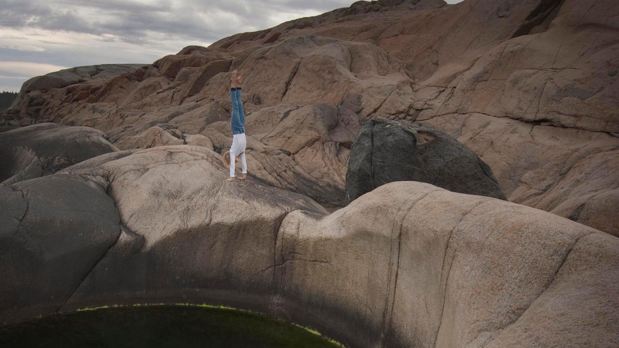 A person standing on the edge of a pothole at Sild in Risør, Southern Norway.