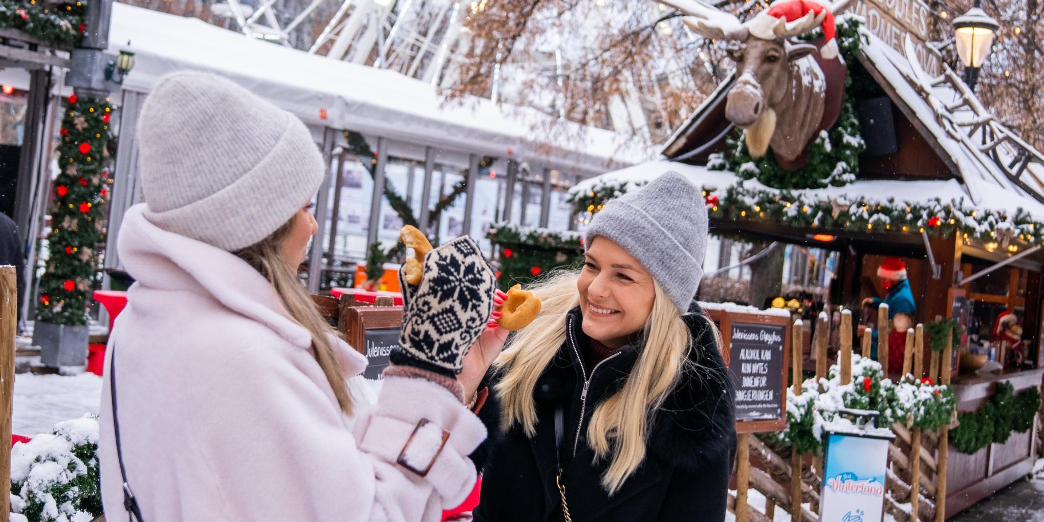 Two women at the Christmas market in Oslo, Eastern Norway