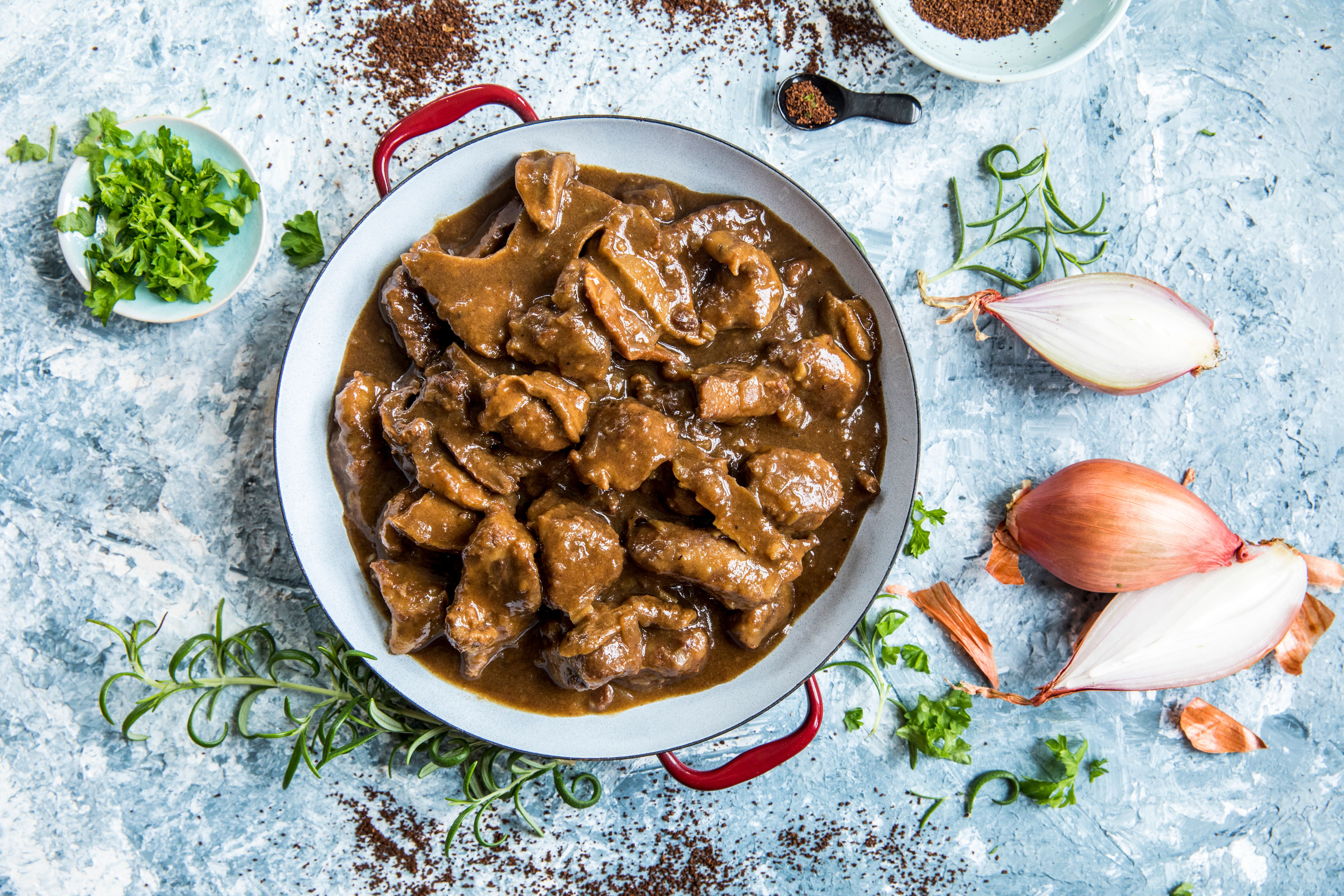 Traditional Norwegian game stew with coffee and mushrooms