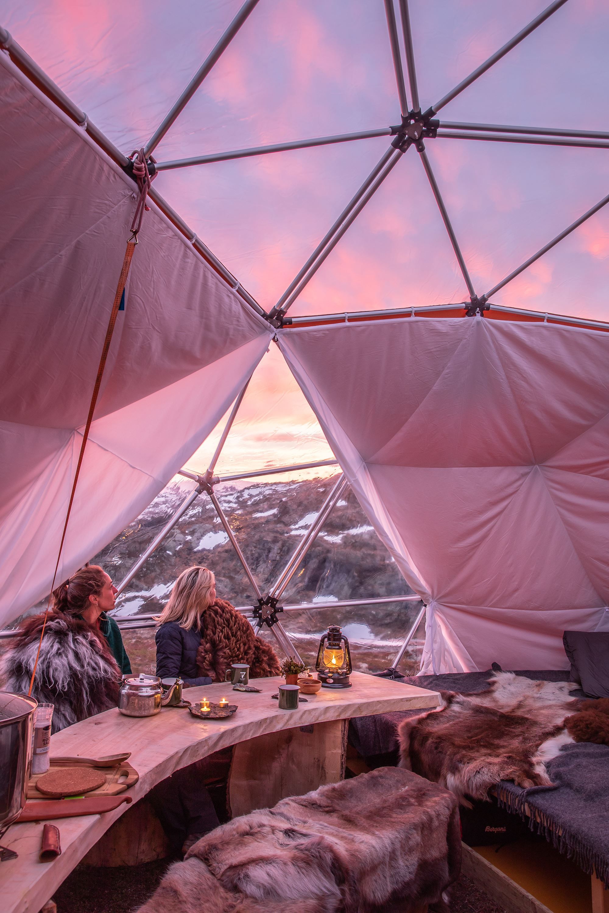 People enjoying the view from inside the sunset dome with glass ceiling
