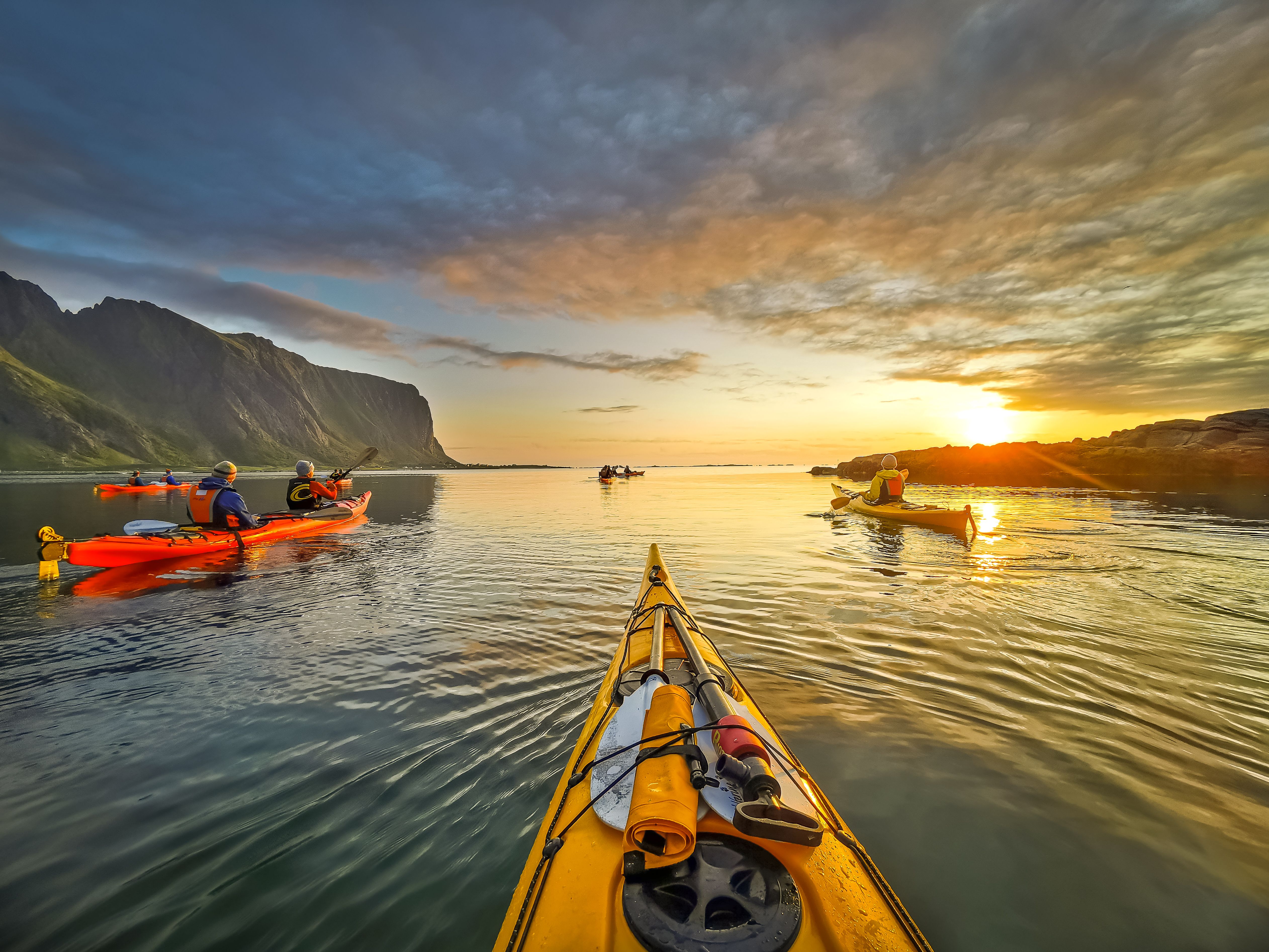 Kayaking in the midnight sun at Eggum in Lofoten, Northern Norway