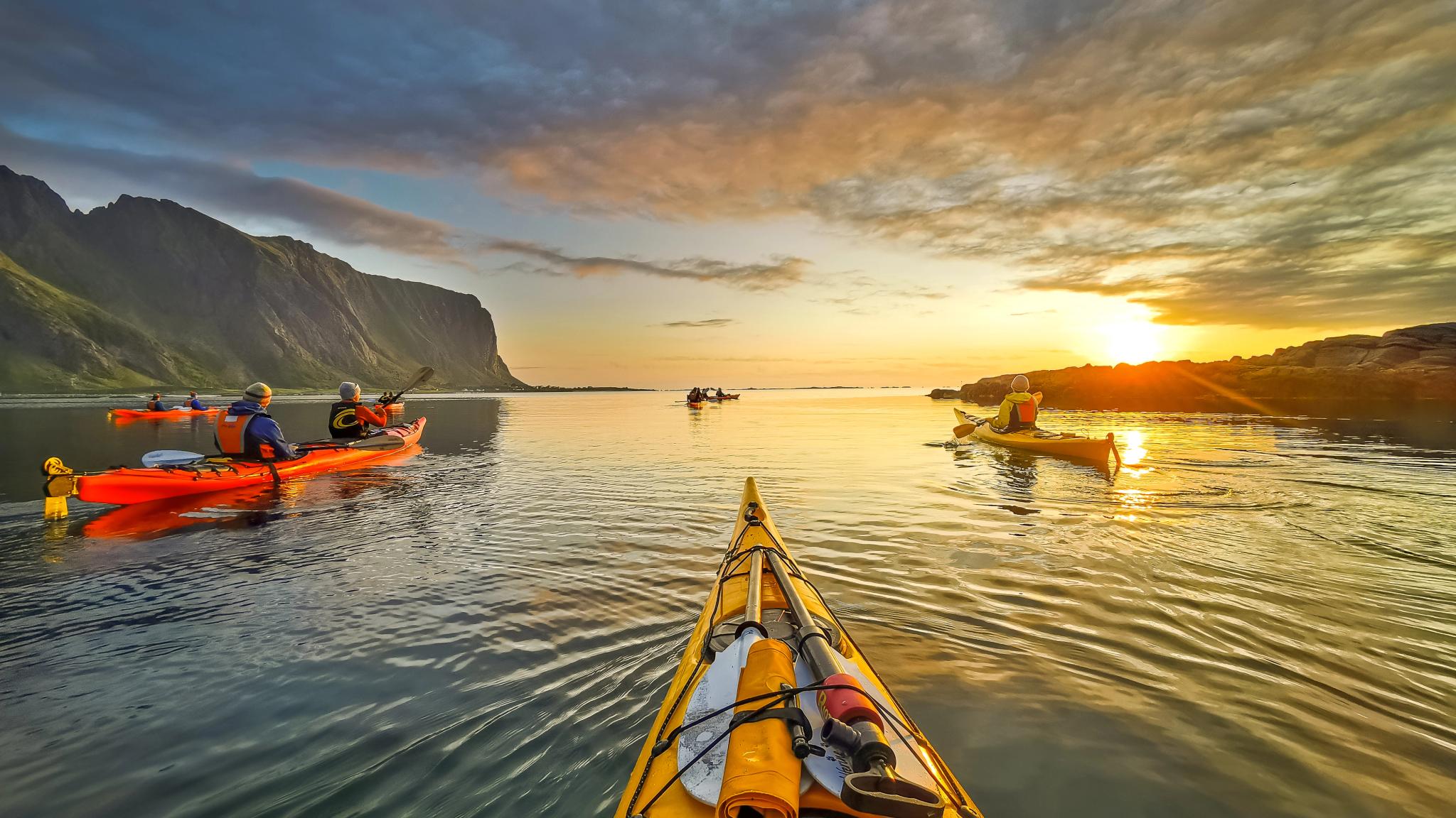 Kayaking in the midnight sun at Eggum in Lofoten, Northern Norway