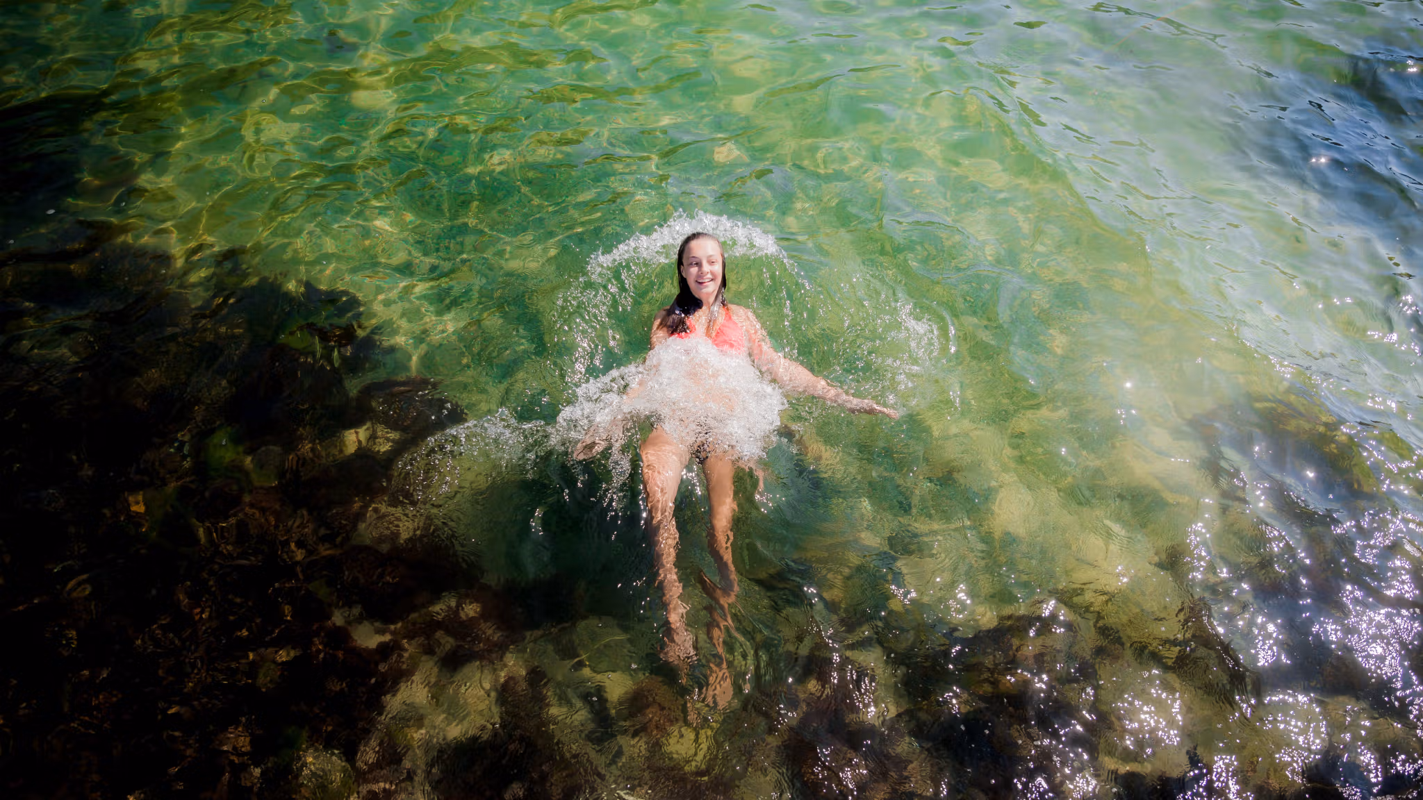 Girl swimming in the sea in Telemark, Eastern Norway