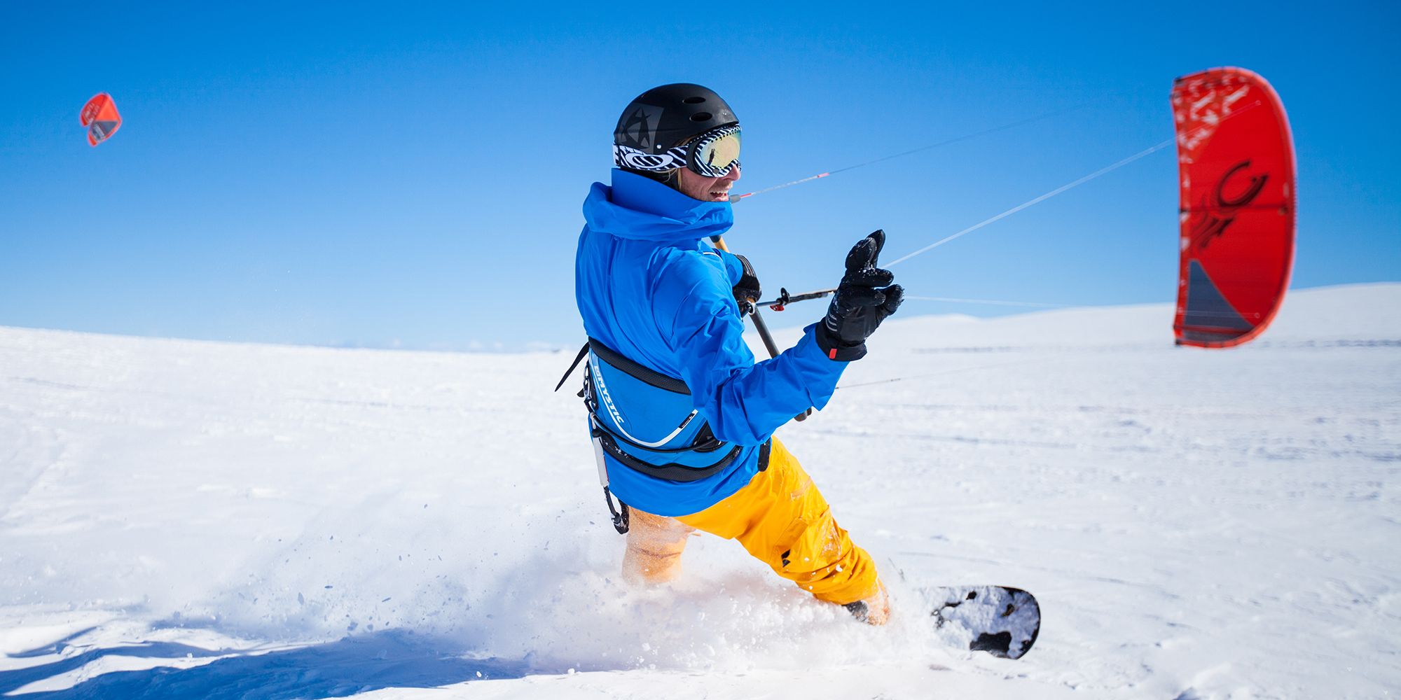 A person snow kiting on the Valdresflye mountain plateau in Valdres, Eastern Norway