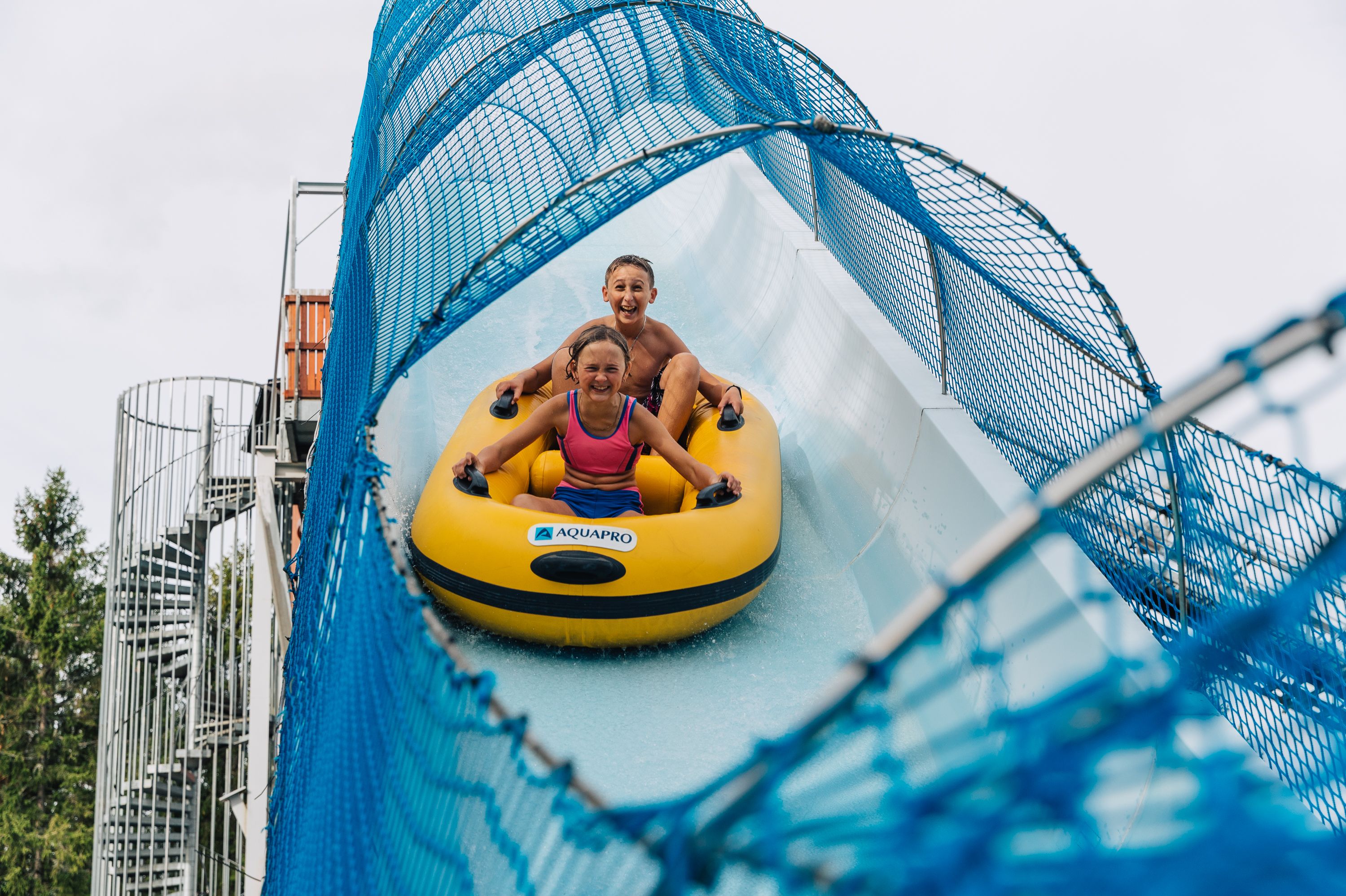 Two children in a water slide at Bø Sommarland waterpark in Telemark, Eastern Norway