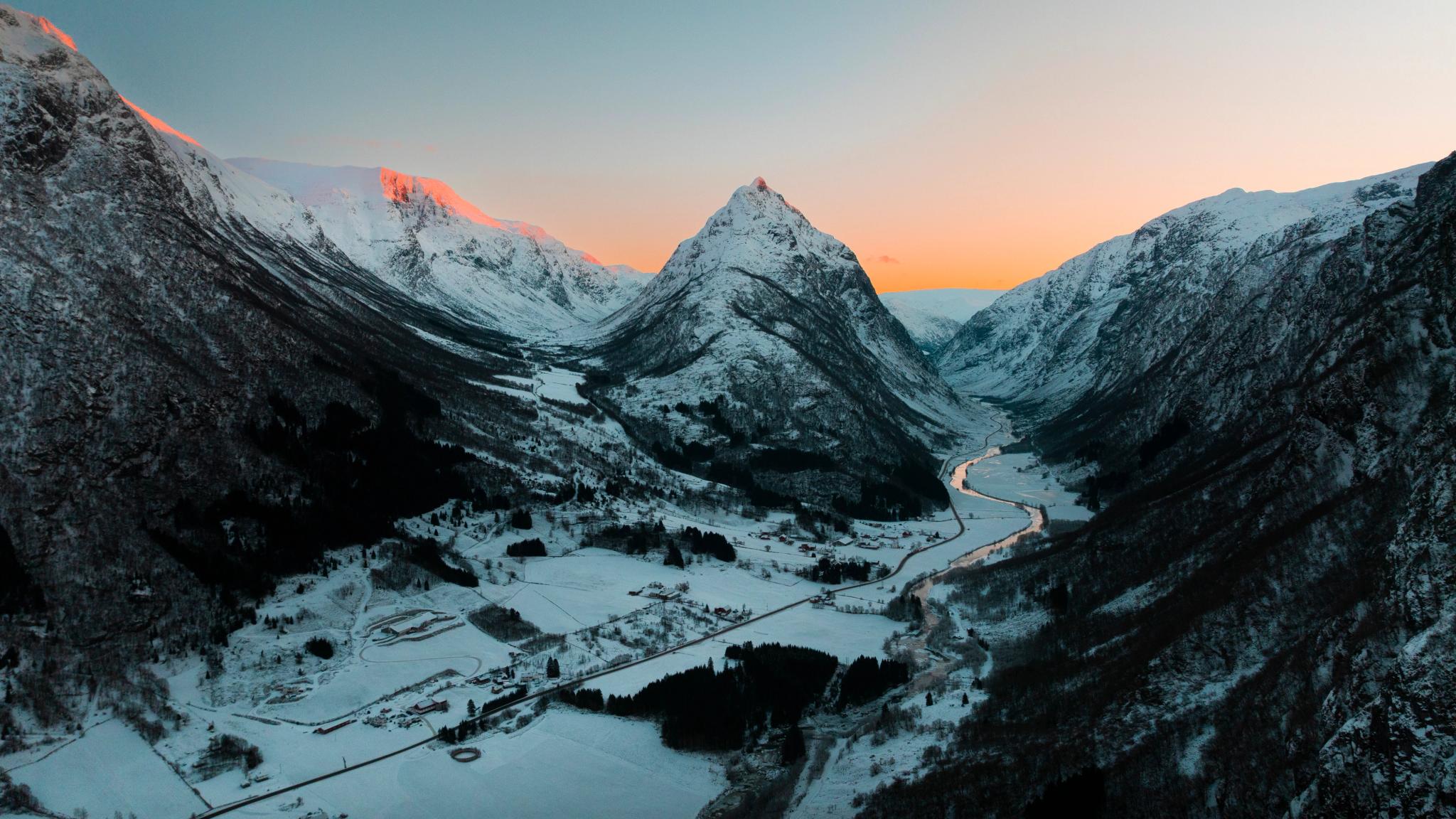 Mountains, a village and a winter sunset.