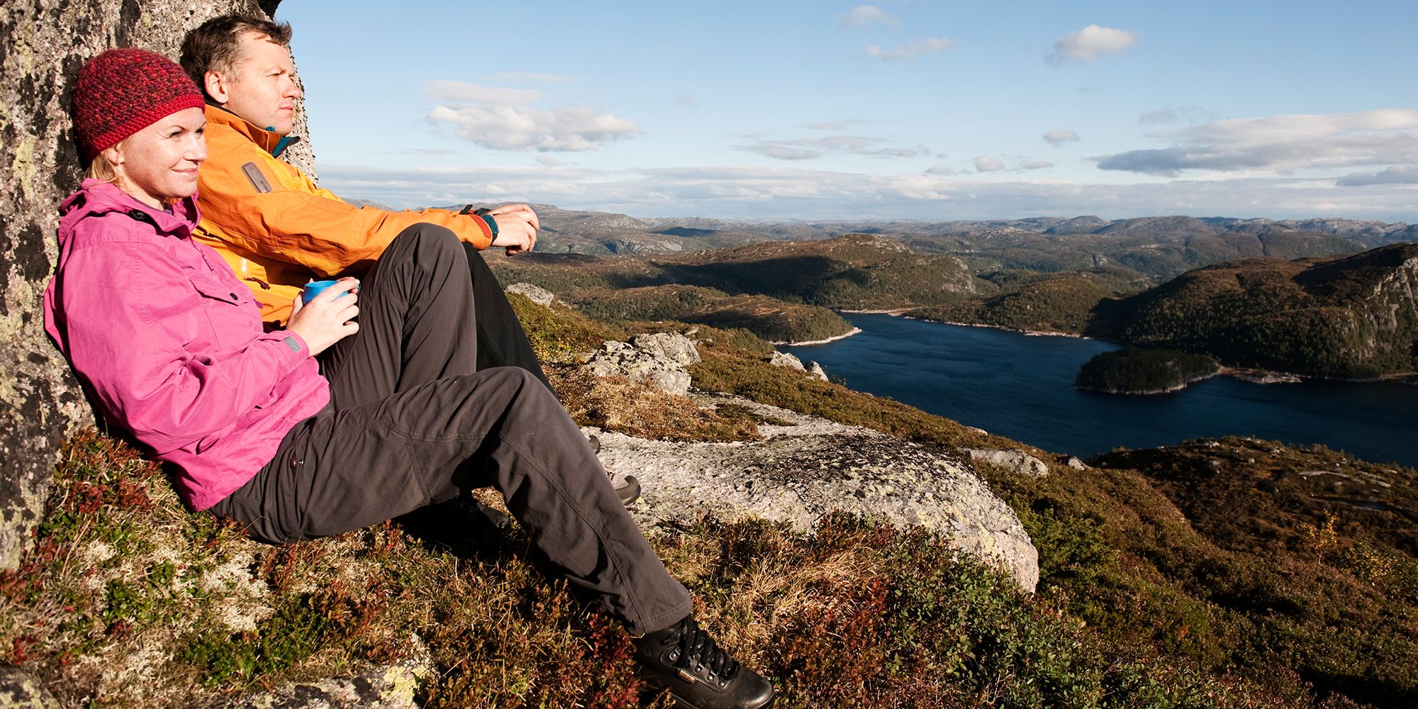 Two people enjoying the view of Sirdal's mountain landscape