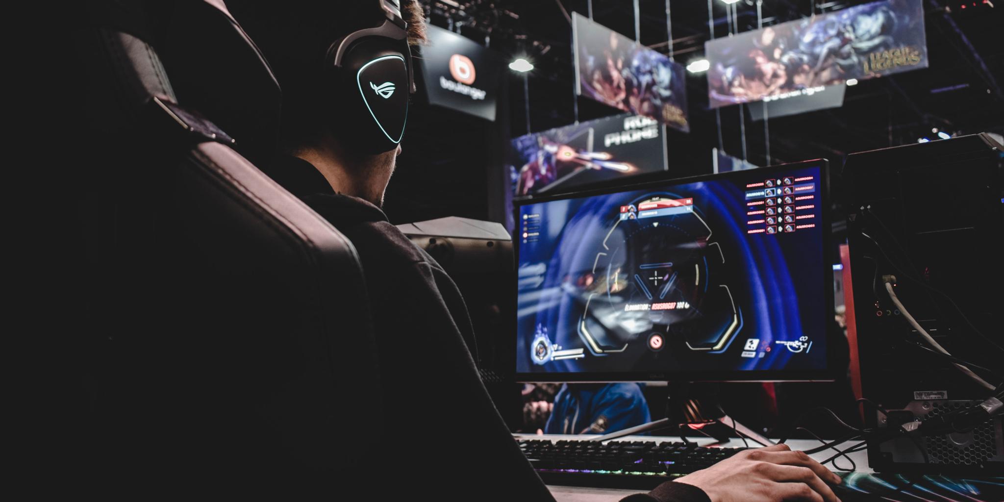 A man playing the game Overwatch on a computer