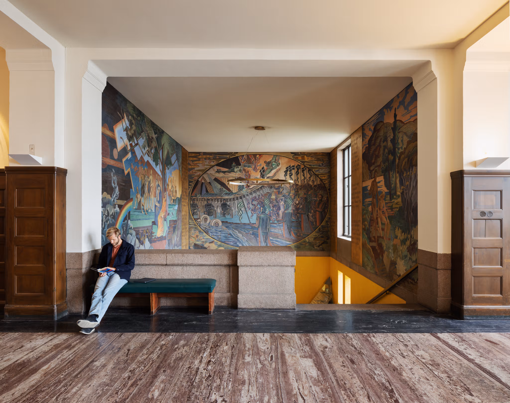 a man sitting in the hall in the National Library.
