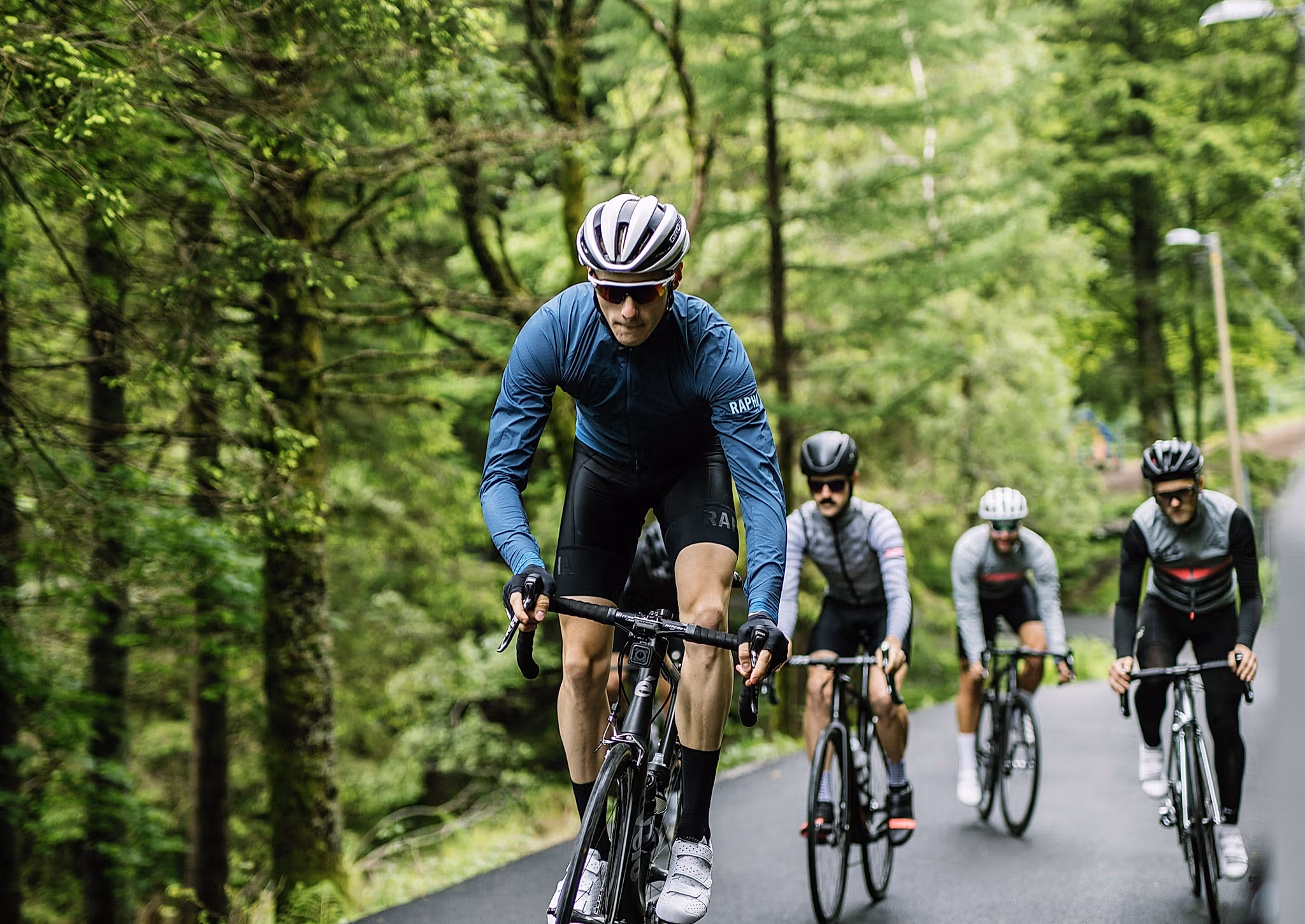 A group of road cyclists biking through Fjord Norway