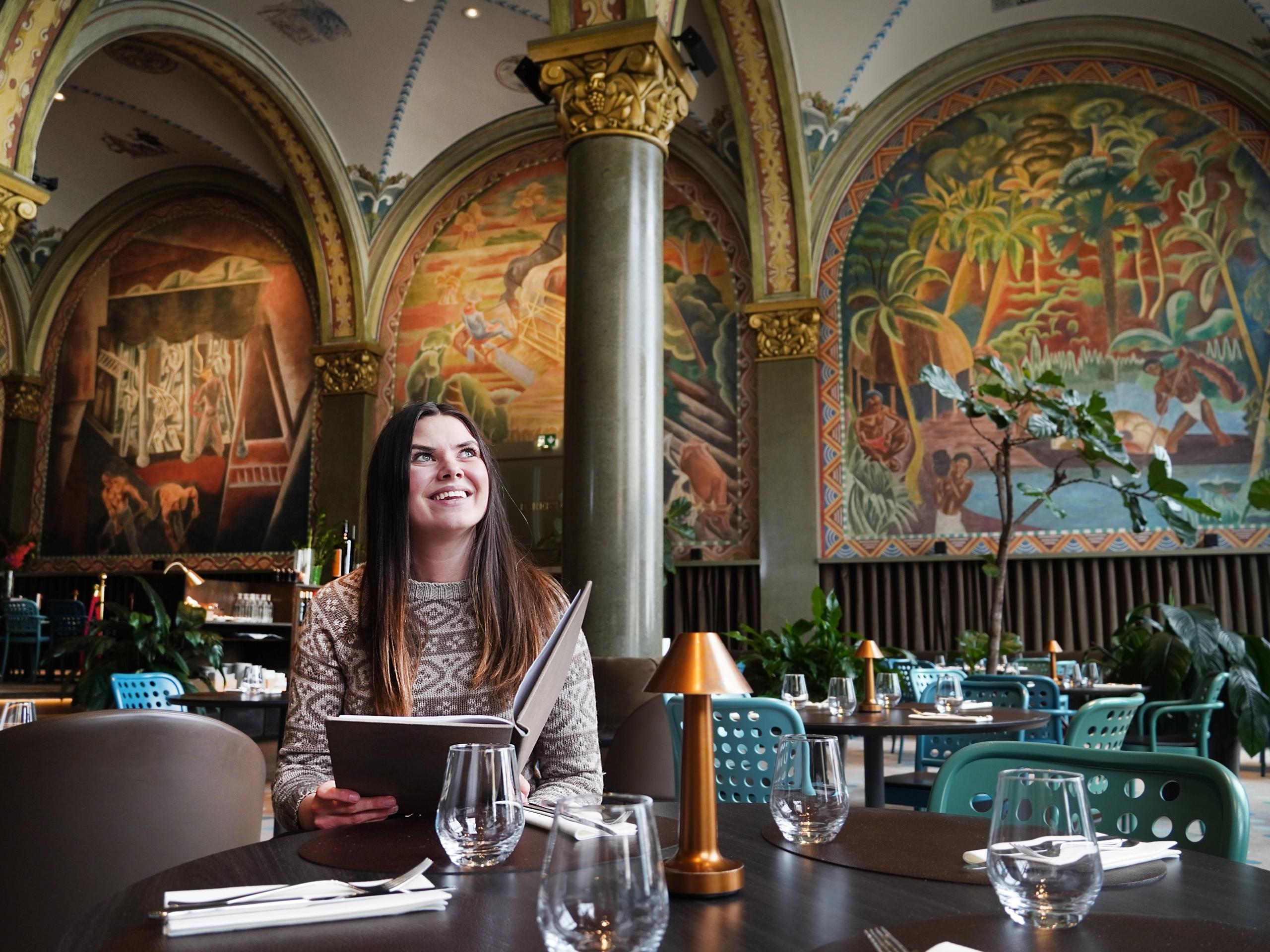 Woman sitting in Frescohallen Restaurant - Bergen Børs Hotel