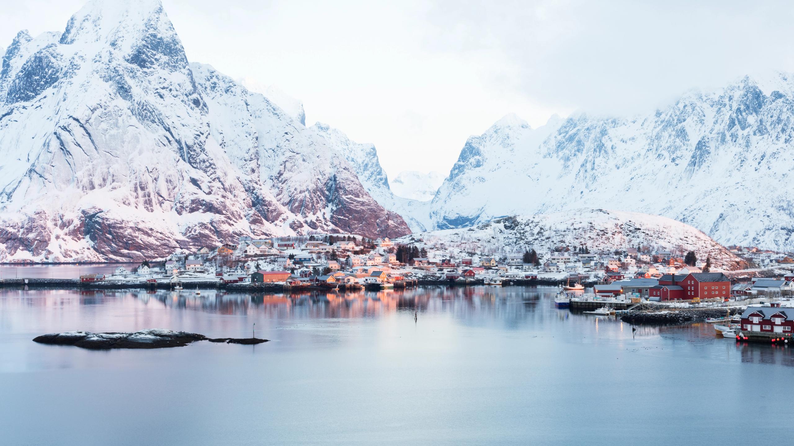 Snowy mountains and a fishing village in Northern Norway.