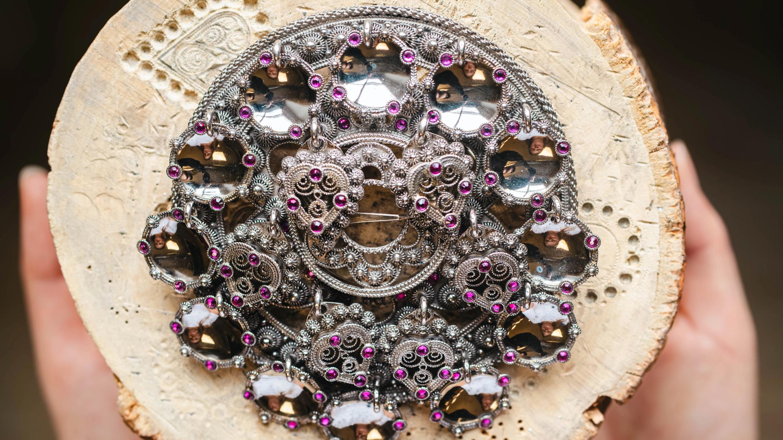 Bolesølje, atraditional Norwegian bunad brooch with raised rings attached in a circle on a base plate.