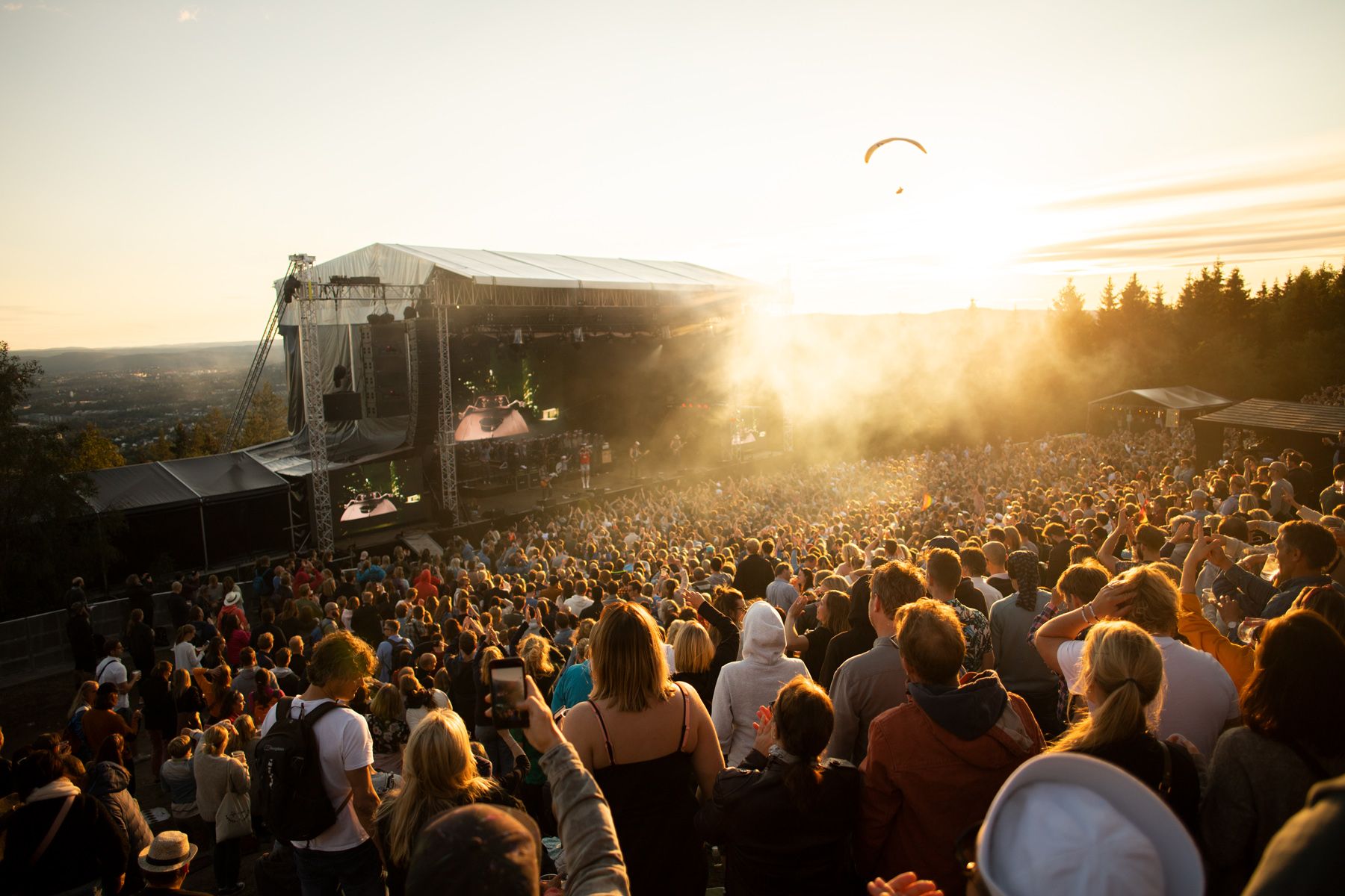 A band performing in front of a large crowd at the OverOslo music festival at Grefsenkollen in Oslo, Eastern Norway