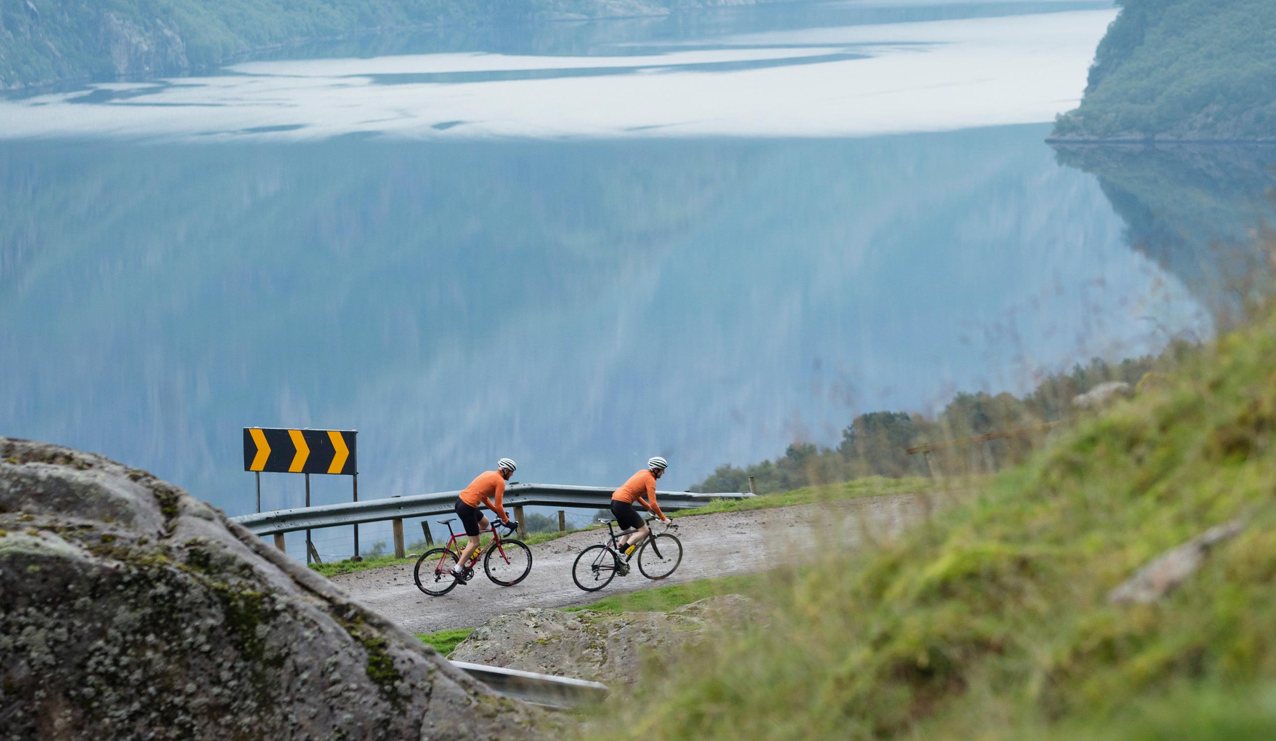 Two people road cycling Skykula in Fjord Norway
