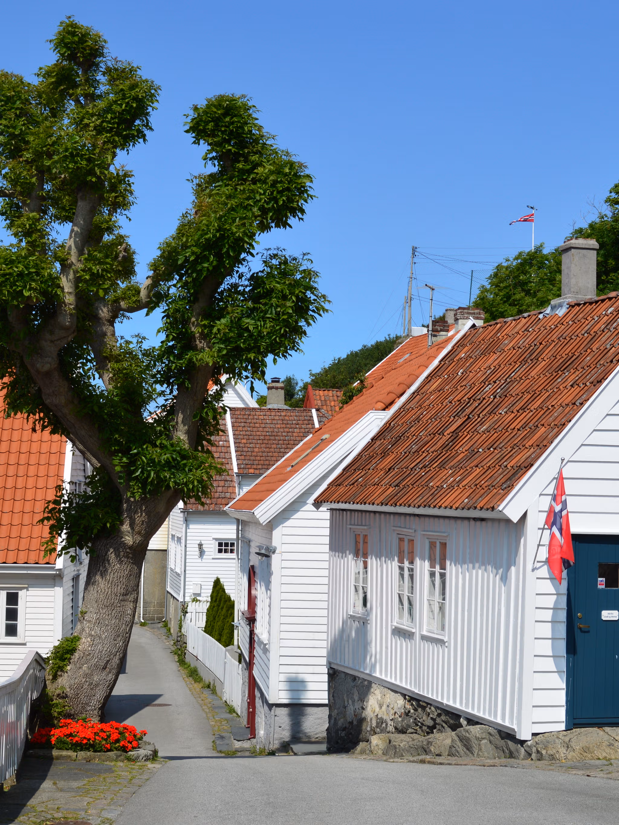 Charming wooden houses in Skudeneshavn outside of Haugesund in Fjord Norway, a coastal gem in southern Norway